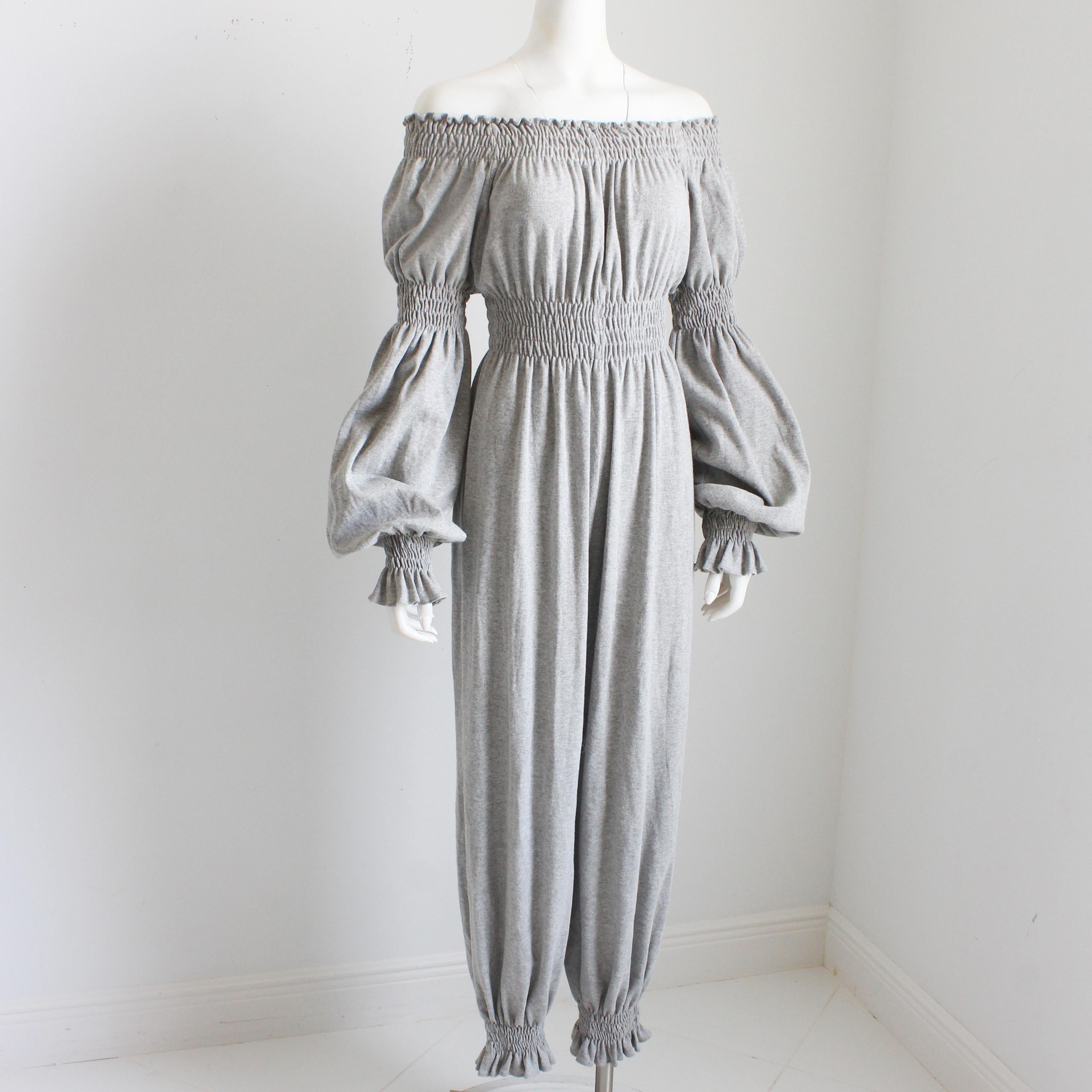 Preowned and almost vintage Norma Kamali OMO jumpsuit.  Made from an incredibly supple and lightweight organic cotton fleece in dove gray, it features shirring at the collar, waist, sleeve ends and ankles, allowing one to style on or off shoulder. 