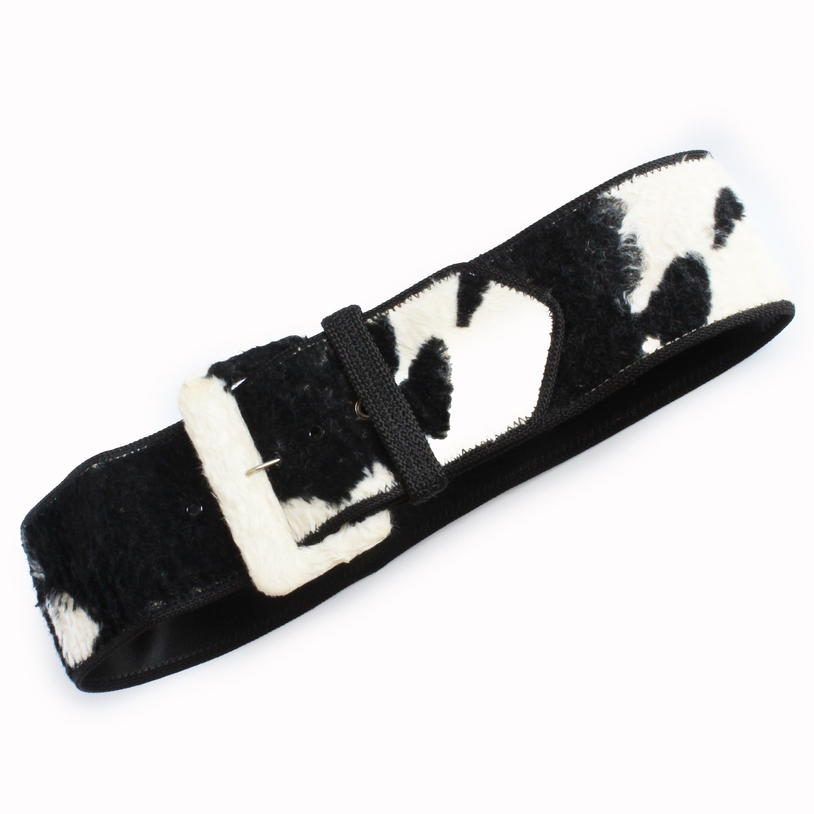 Preowned, vintage Norma Kamali OMO wide belt, likely made in the early 90s.  Backed in leather, this belt features a black and white faux fur cow print throughout! 

Retro fabulous and fun - and so easy to wear and style.

Approximate measurements: