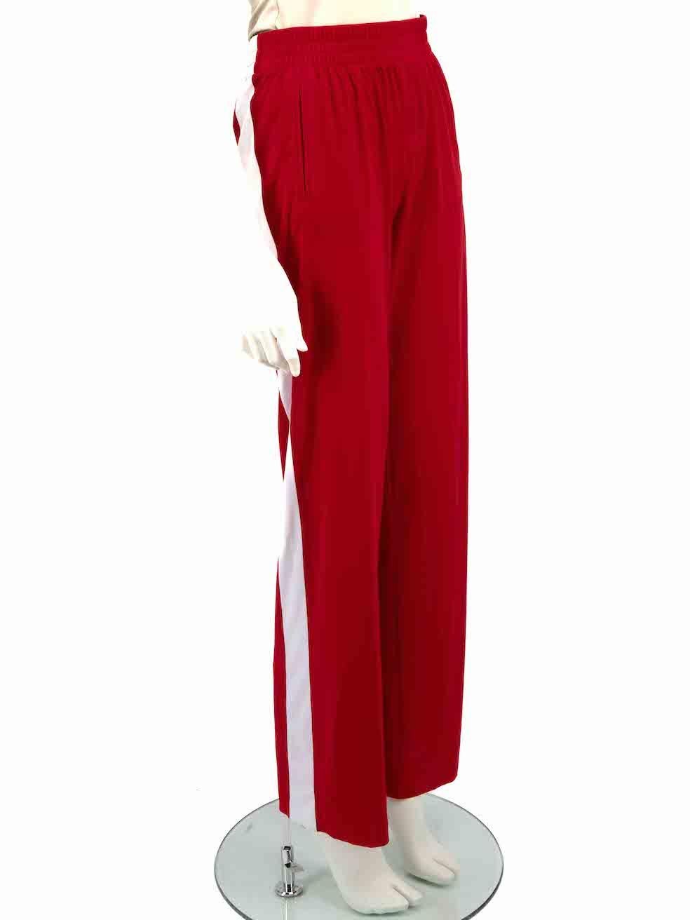 CONDITION is Very good. Minimal wear to trousers is evident. Minimal wear to both cuffs with heat creasing on this used Norma Kamali designer resale item.
 
 Details
 Red
 Polyester
 Straight leg trousers
 Mid rise
 White striped accent on sides
