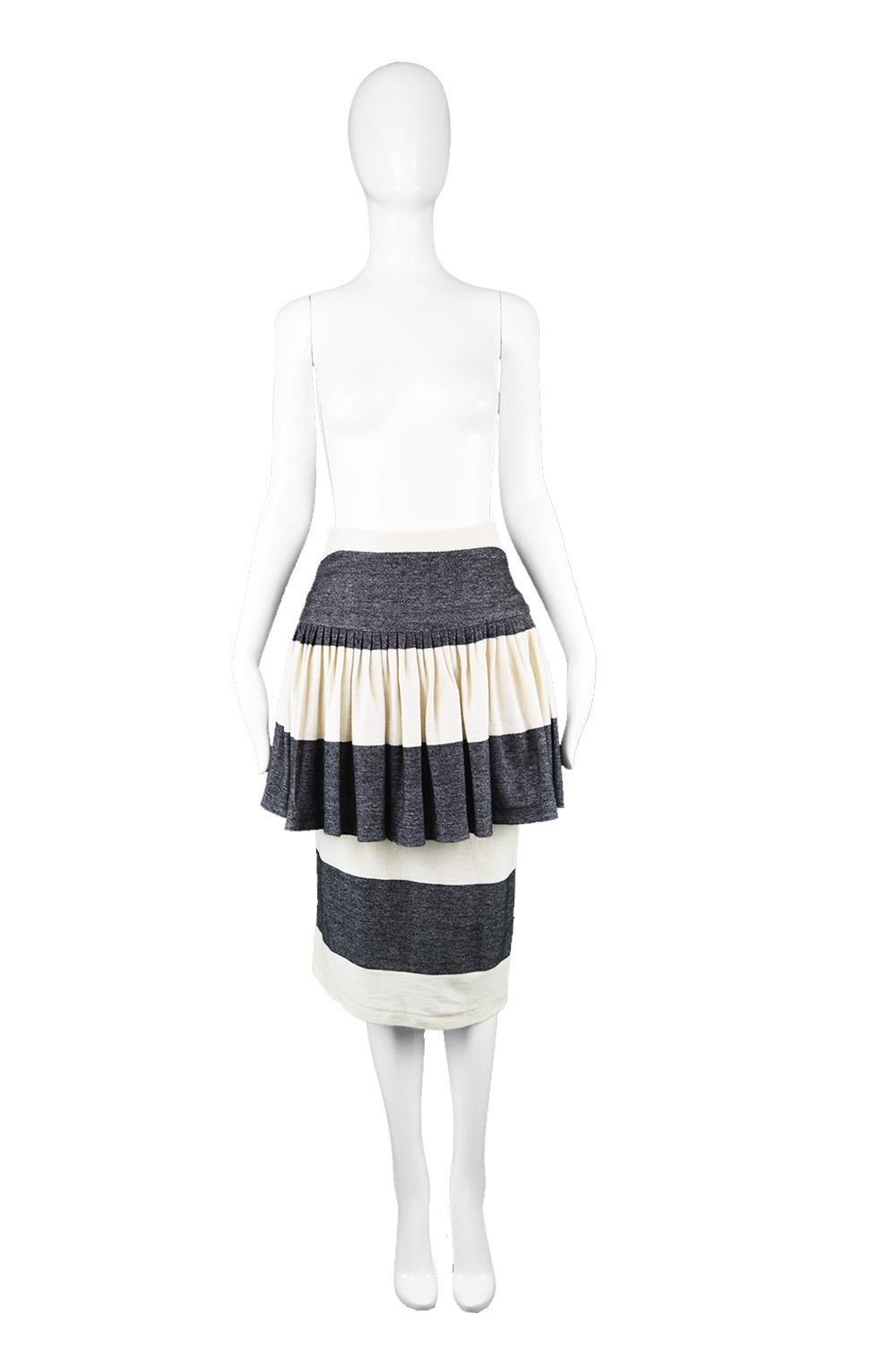Norma Kamali Vintage Grey & White Cotton Jersey Avant Garde Peplum Skirt, 1980s

Estimated Size: UK 8/ US 4/ EU 36. Please check measurements. 
Waist - 26” / 66cm
Hips - 36” / 91cm
Length (Waist to Hem) - 31” / 79cm

Condition: Excellent Vintage