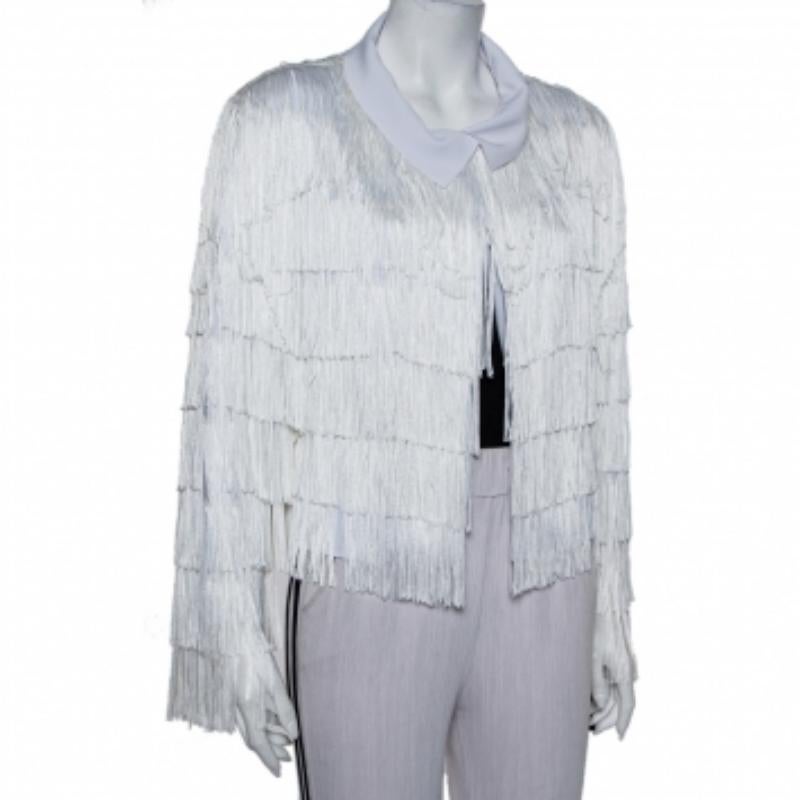 A statement-making jacket you can pair with a bodysuit and simple blue jeans or over an LBD dress for a chic style. Designed by Norma Kamali, the jacket is made for movement. It displays tiers of fringes that dangle with every move you make. It is