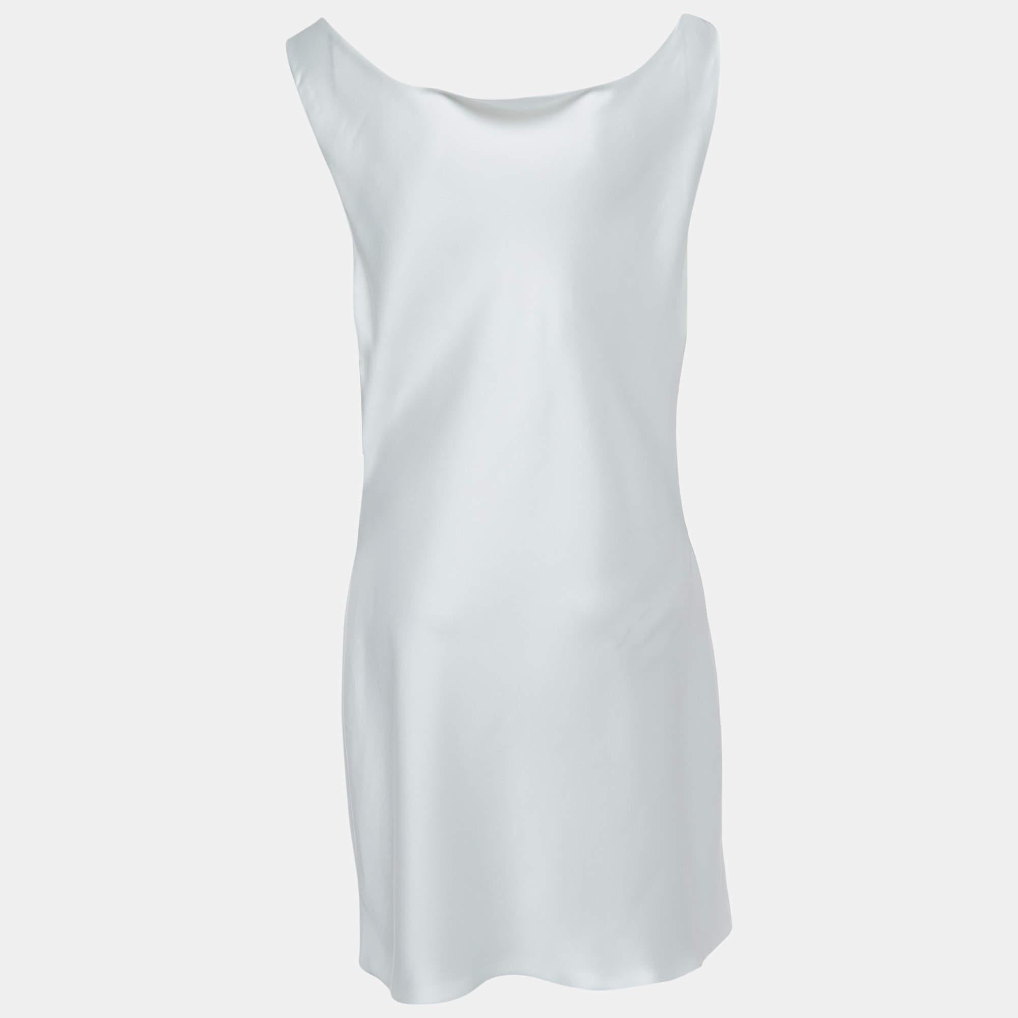 This designer dress is a chic and stylish garment that exudes elegance and sophistication. With its sleek design flattering silhouette and high quality craftsmanship this dress is perfect for any special occasion or evening event ensuring you stand