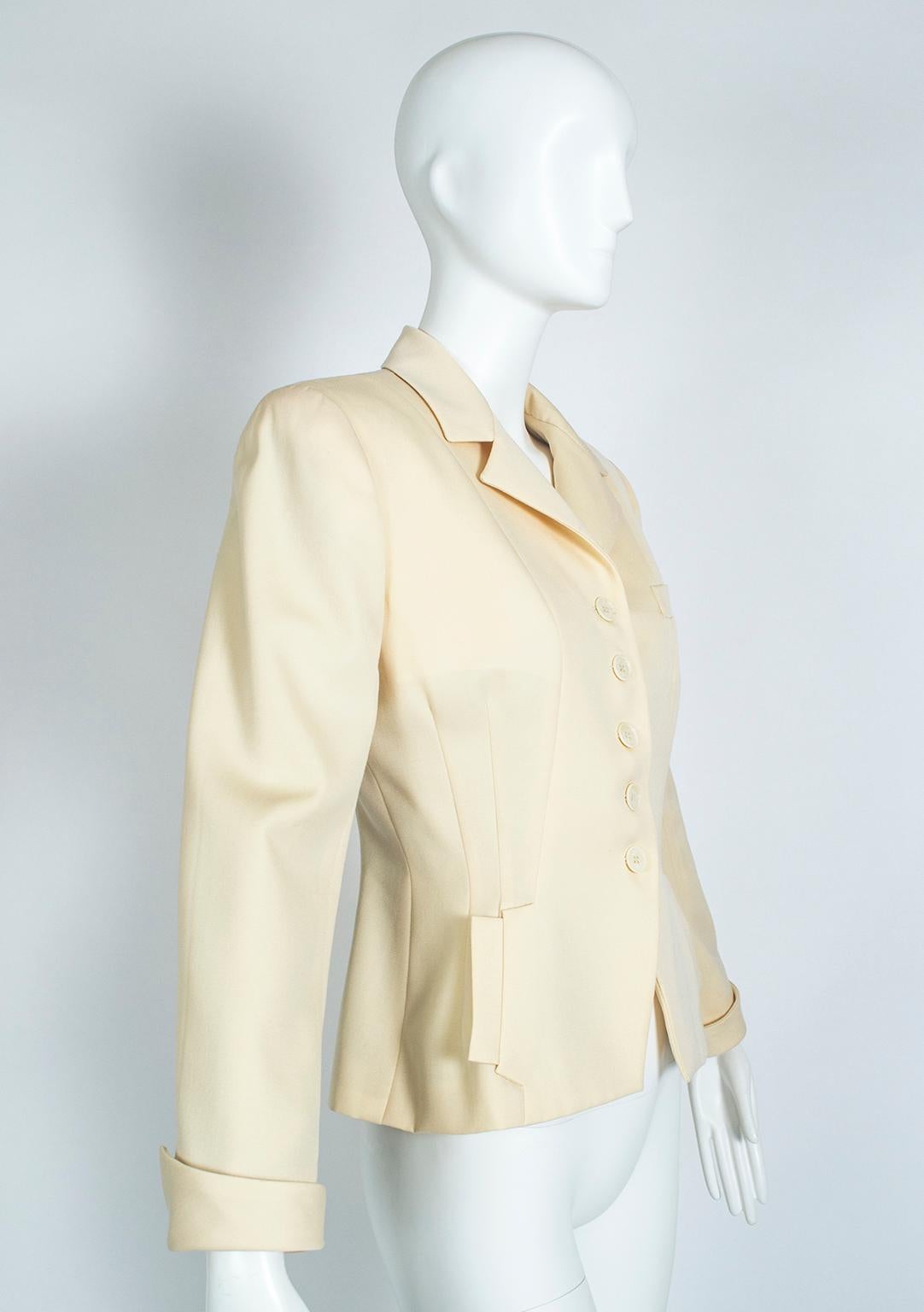 A dead-ringer for Dior’s groundbreaking 1947 Bar Jacket, this blazer features the same sculpted silhouette as its predecessor with modernized details like sharp shoulders and tiered inseam pockets. The best of both worlds.

Sculpted peplum jacket