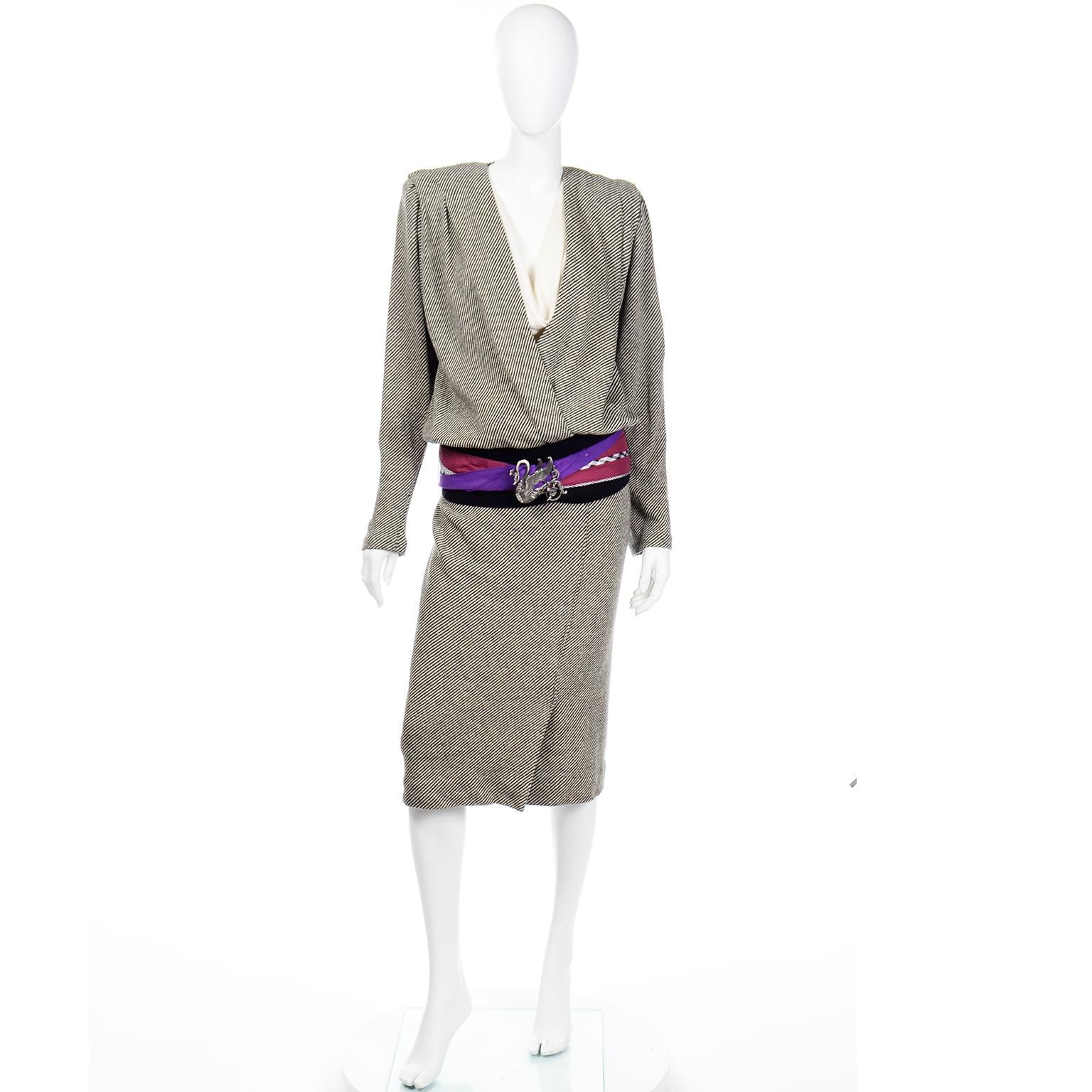This is a wonderful 2 piece dress & belt from Norma Walters. This 1980's ensemble includes a linen top with matching pencil skirt and linen mixed pattern belt with a really unique peacock metal buckle. The previous owner wore the belt with this