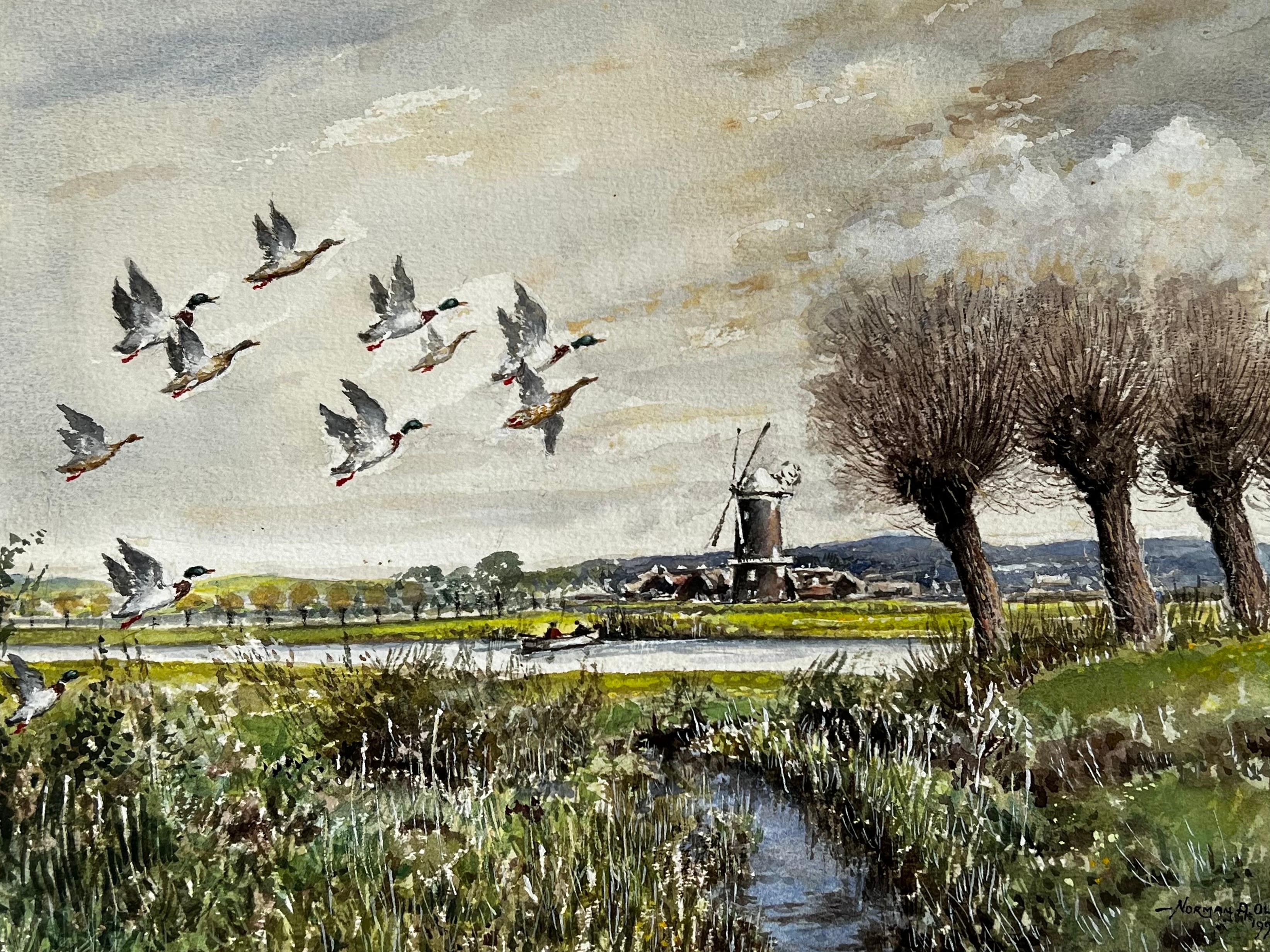 Mallard Ducks Flying Over The Marshes Past The Mill Beyond - Painting by Norman A Olley