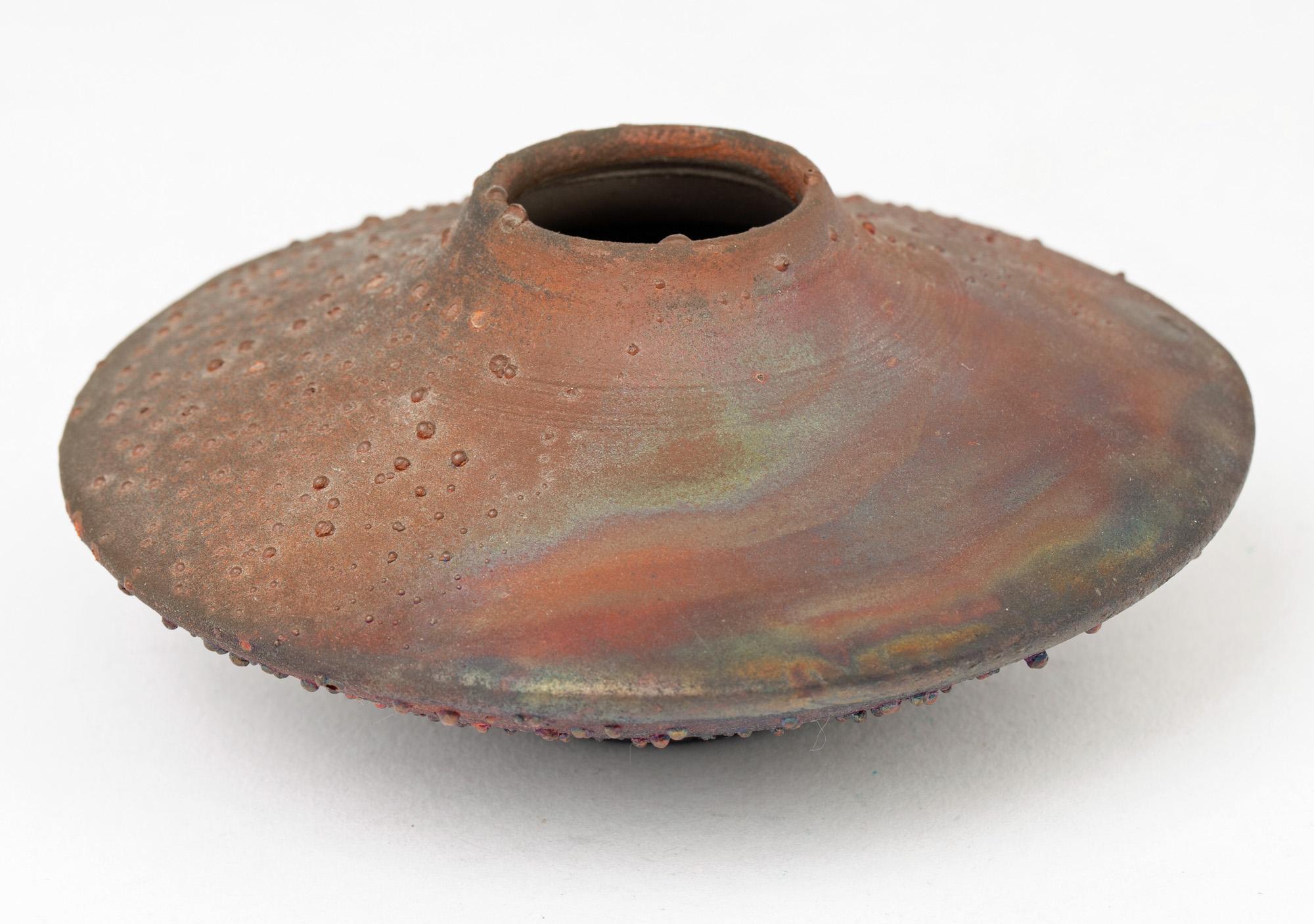 A stylish raku glazed squat form studio pottery vase by renowned USA potter Norman Bacon and made between the 1970’s and 1990’s. Based in Woodstock, NY, Bacon produced a number of interesting and unique pieces and this delightful vase is a wonderful