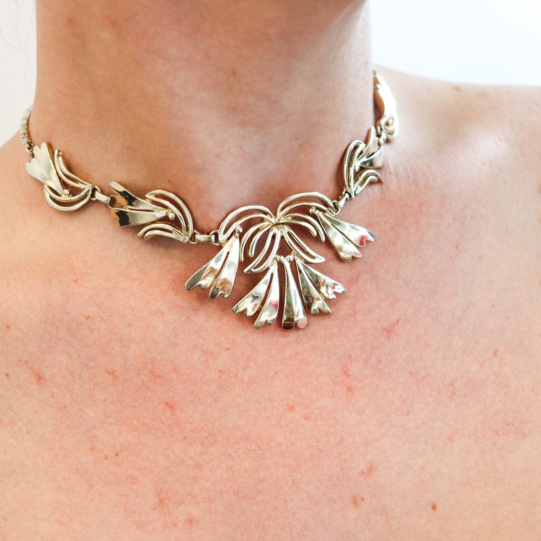 Necklace designed by Norman Bel Geddes.

This is a fabulous retro-modernist necklace, created in America by the industrial designer Norman Bel Geddes, back in the late 1950. The design of this necklace was conceived during the post war period. Very