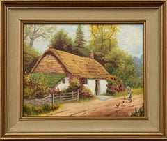 Idyllic Bauernhaus mit Dame, die Hühner füttert, in der Landschaft Irlandslandschaft