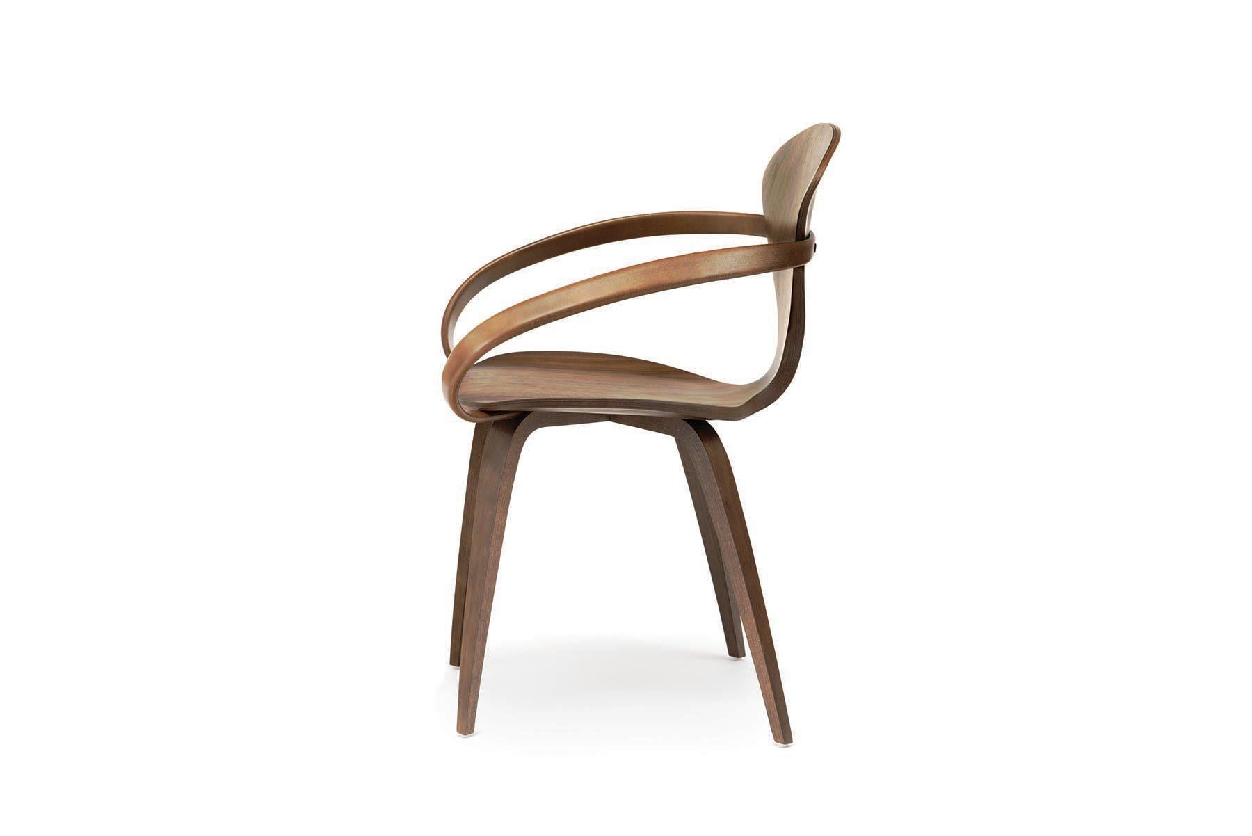 Originally introduced in 1958, the iconic molded plywood armchair by Norman Cherner is found in collections worldwide. Reissued in exacting detail from the original drawings and molds, the armchair elegantly combines a unique molded plywood shell of
