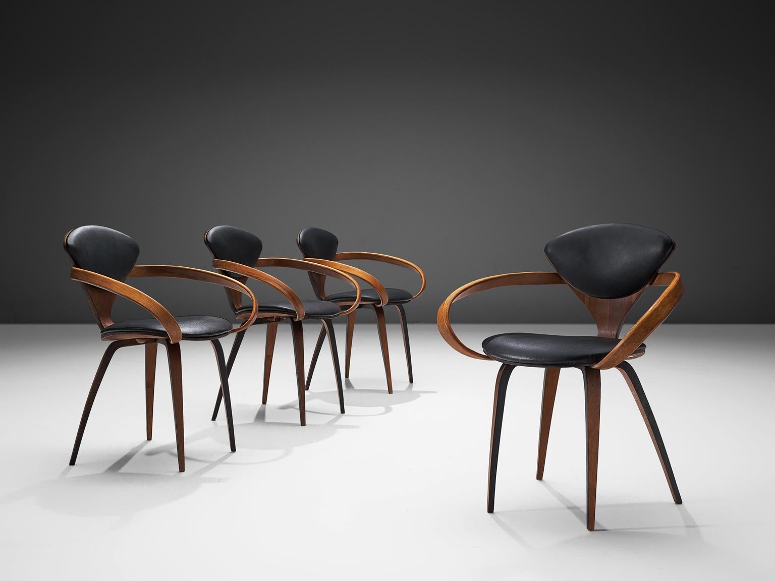 Norman Cherner for Plycraft, set of four dining chairs, walnut plywood and black leather, United States, design 1957, production 1965.

These four Classic Norman Cherner plywood chairs date from 1965. Their iconic shape resembles something like a