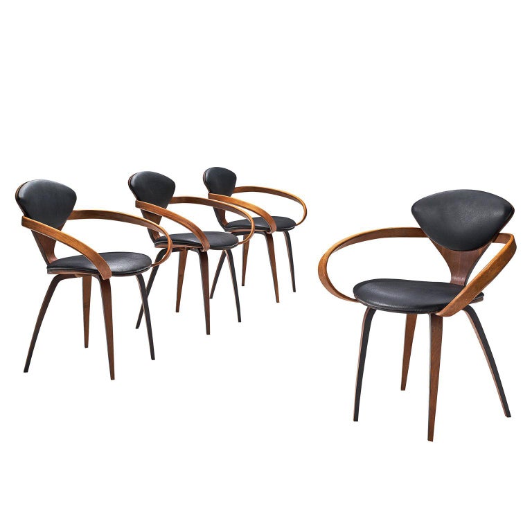 Norman Cherner For Plycraft Four Walnut And Black Leather Dining Chairs