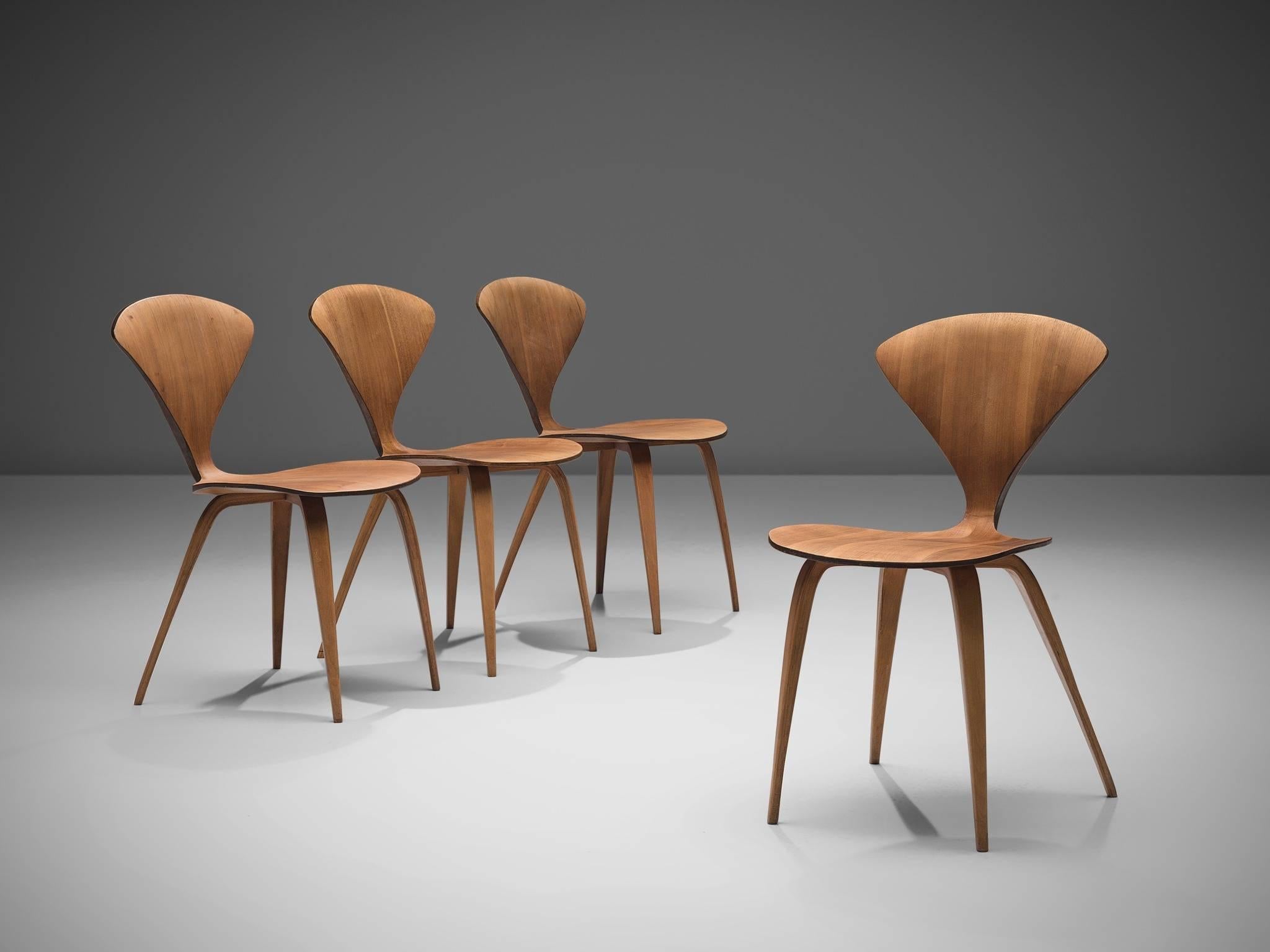 Norman Cherner for Plycraft, set of four dining chairs, walnut and plywood, United States 1957.

These four Classic Norman Cherner plywood chairs date from 1957. Their iconic shape resembles something like a delicate butterfly, yet do not be