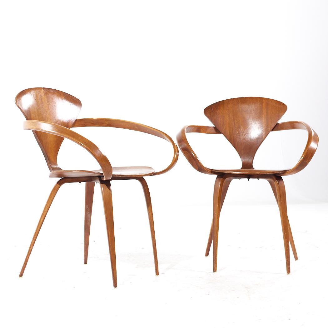 Norman Cherner for Plycraft Mid Century Arm Chairs - Pair

Each chair measures: 25 wide x 22 deep x 31.5 inches high, with a seat height of 17.5 and arm height/chair clearance of 25.5 inches

All pieces of furniture can be had in what we call