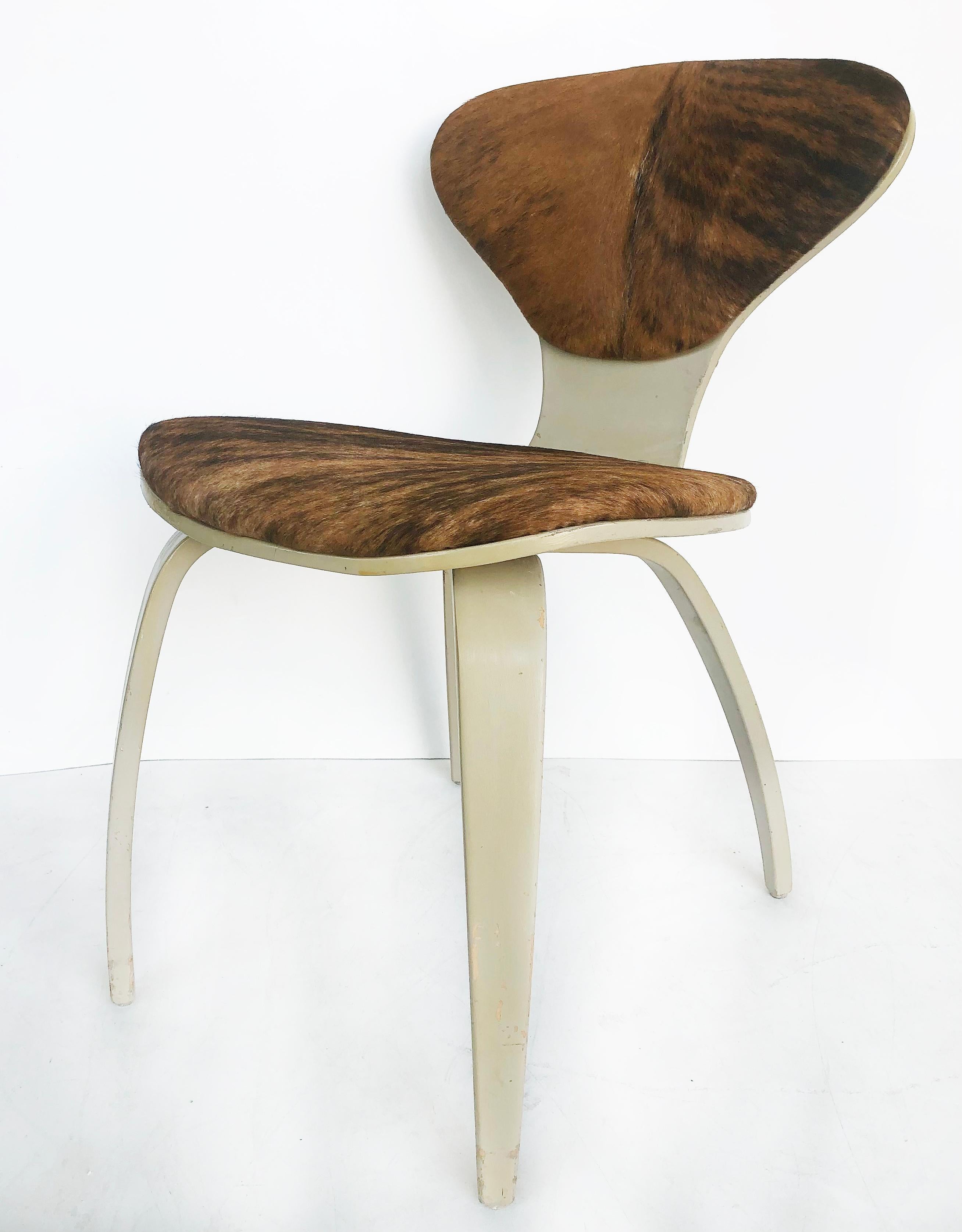 Norman Cherner Plycraft chair Upholstered in Cowhide and painted

Offered for sale is a painted bentwood and laminated wood chair designed by Norman Cherner for Plycraft Furniture Company. This stylish mid-century iconic chair is upholstered in