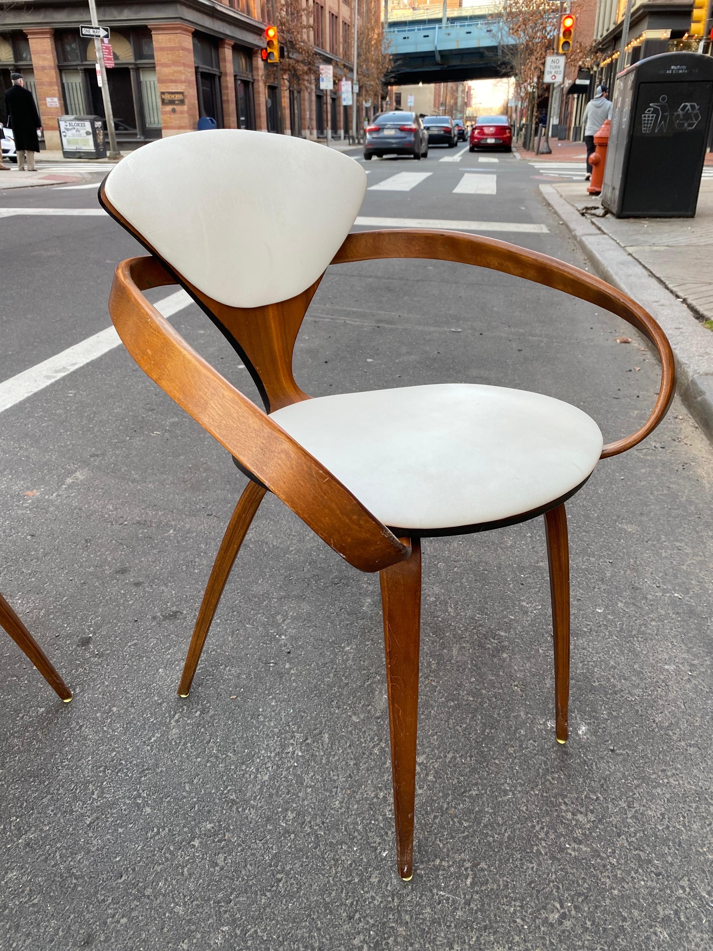 Pair of very Original Norman Cherner Pretzel armchairs. Chairs in nice shape, original vinyl seat shows a little wear but chairs are very solid! Iconic Mid-Century Design. Chairs retain their labels to underside.
