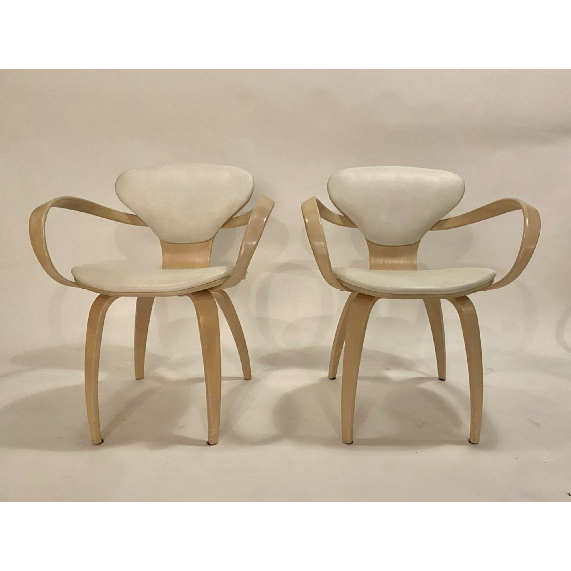 Pretzel arm chairs by Norman Cherner for Plycraft in bleached white wood and ivory faux leather. Good original condition.



