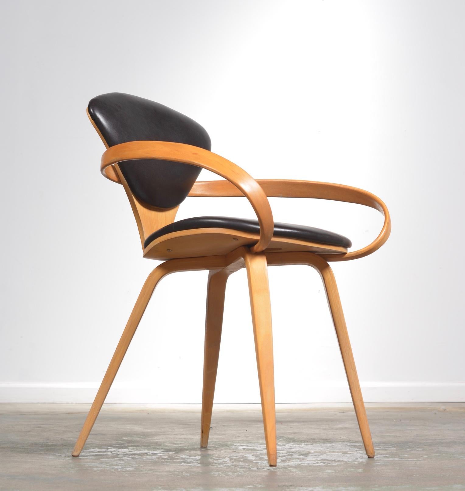 Original Norman Cherner pretzel dining chairs, made by Plycraft, USA in the 1960s. Bentwood frame with a dark black/ brown vinyl seat and back.  Priced per chair,  4 available.  On display in our Los Angeles Arts District showroom.  