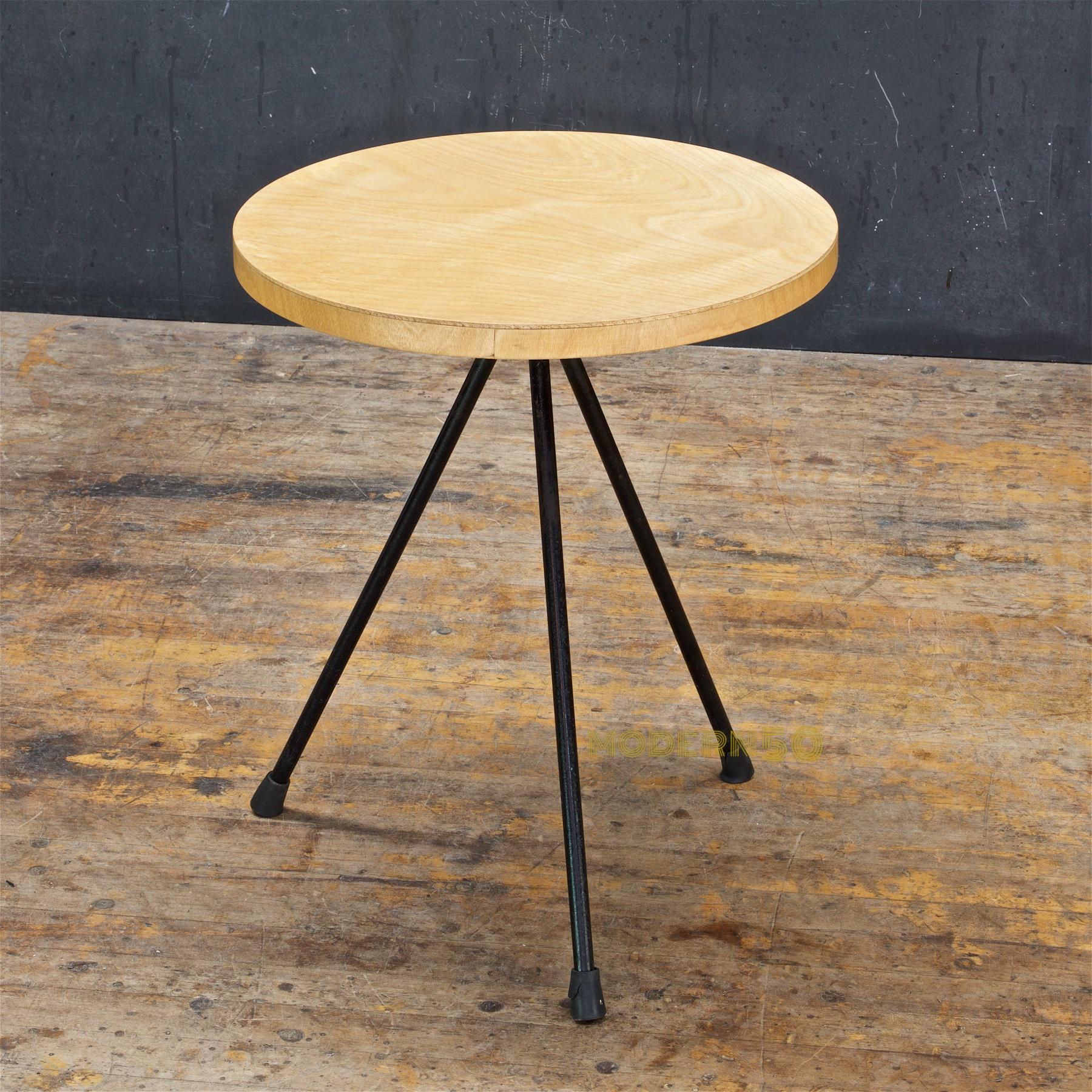 Rare petite side table, awarded MoMA's Good Design distinction. Tabletop surface and edge has been restored. There is a very shallow small indention on the edge of the top, this can be seen in different light, very minimal.
 