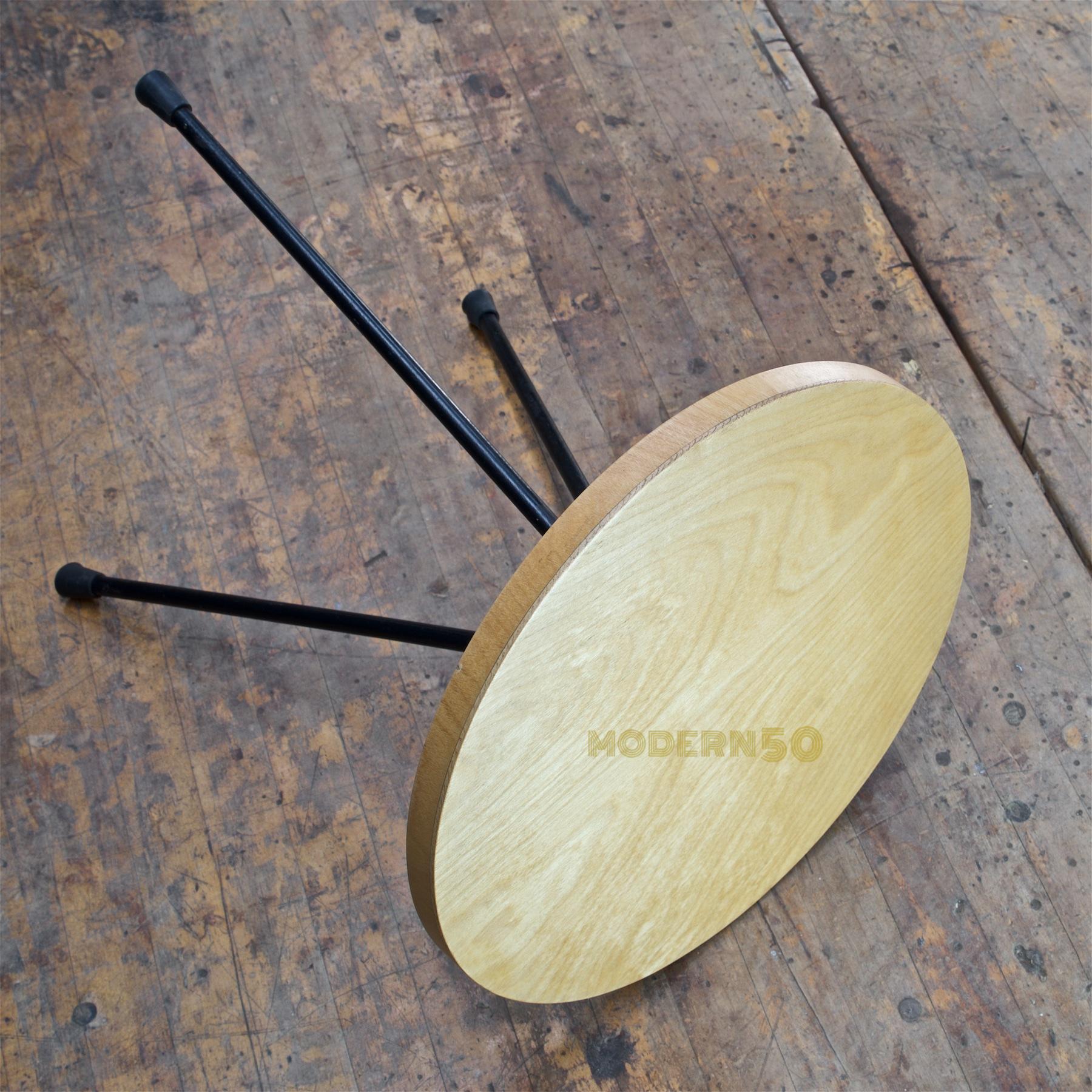 3 legged round particle board table