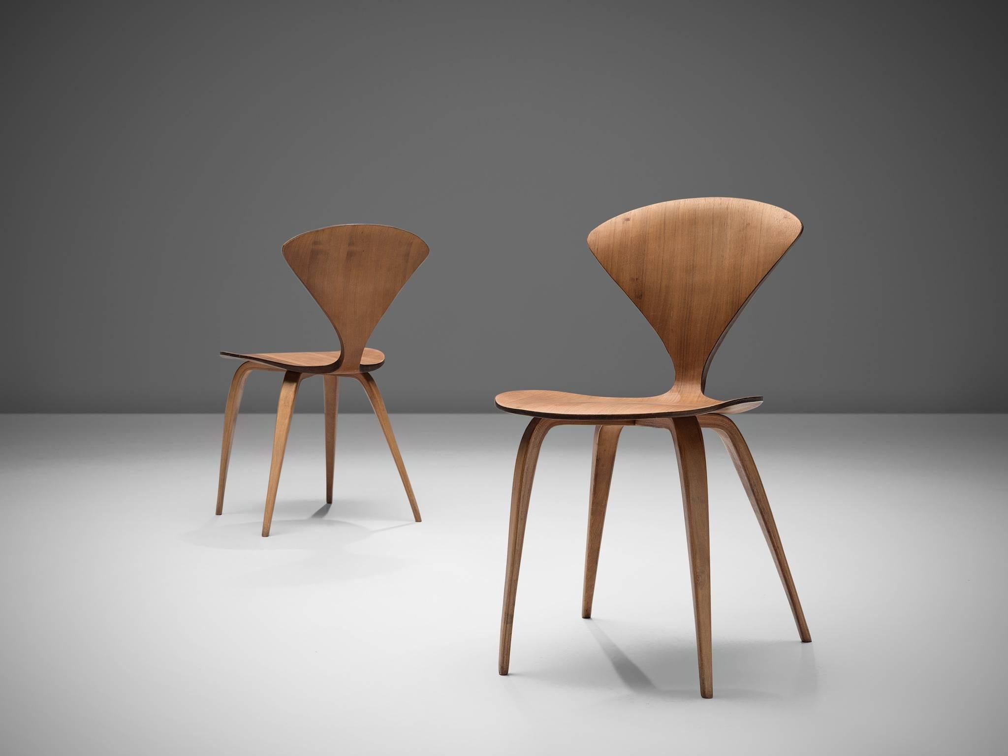 Norman Cherner for Plycraft, set of two side or dining chairs, walnut and plywood, United States 1957.

These two classic Norman Cherner plywood chairs date from 1957. Their iconic shape resembles something like a delicate butterfly, yet do not be