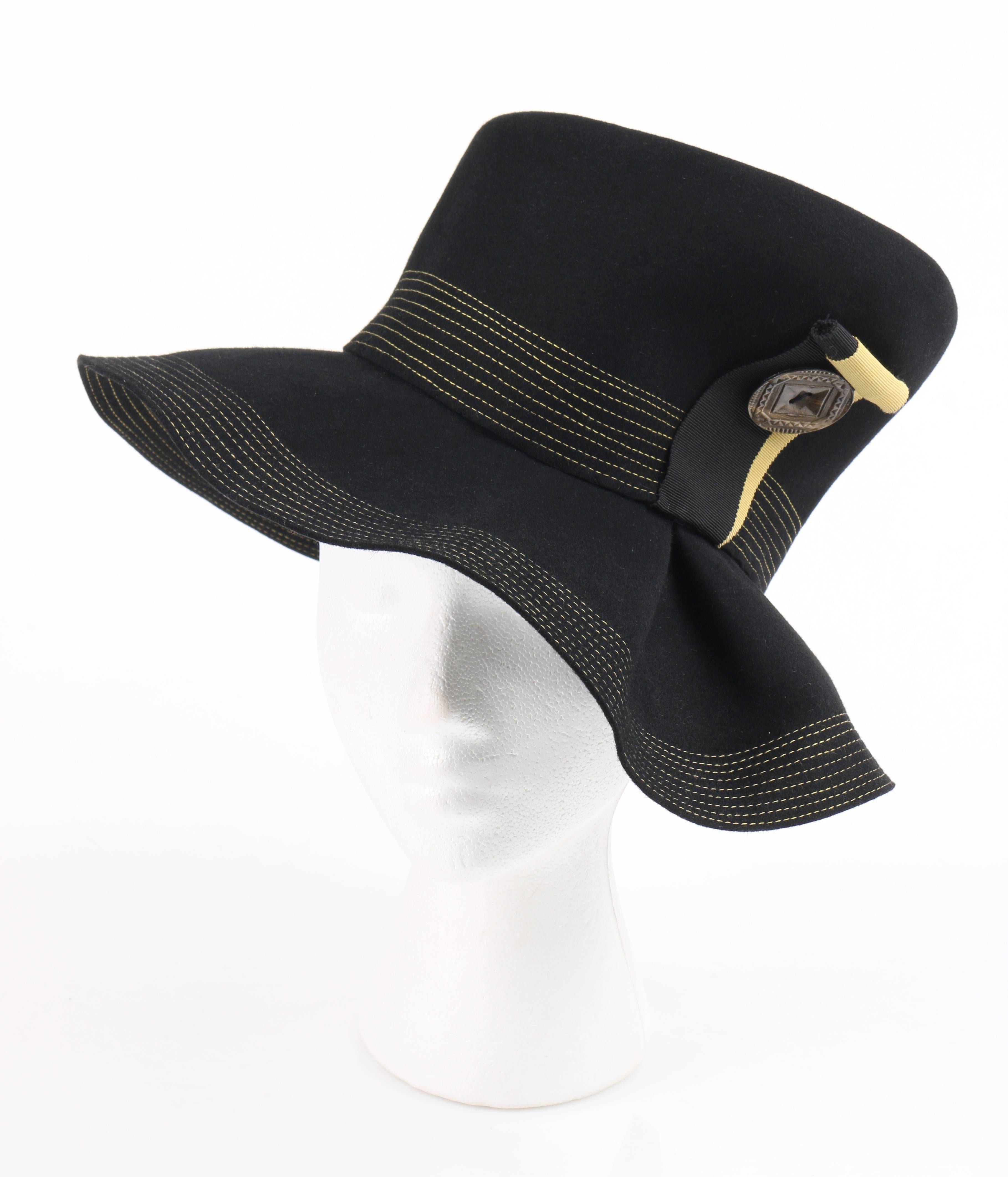 Vintage Norman Durand Original c.1940's black fur felt asymmetrical sculptural hat. Black fur felt body with yellow contrasting top stitch around edge of brim and crown of hat. Wide slouched brim with single inverted box pleat at left front. Tall