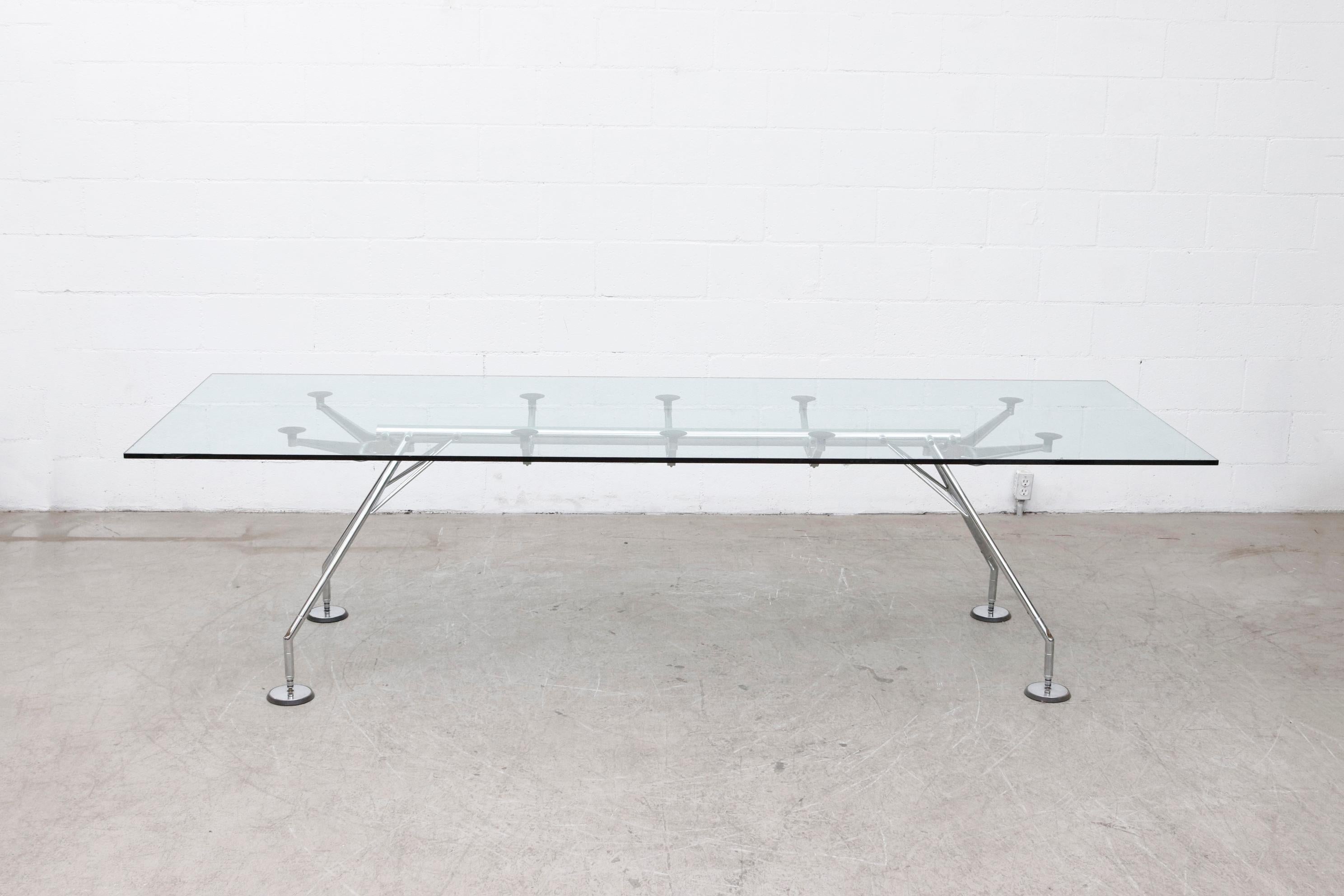 Norman foster for Tecno clear glass dining or conference table with chrome legs. Frame measures 83 x 26.5, glass is 1/2