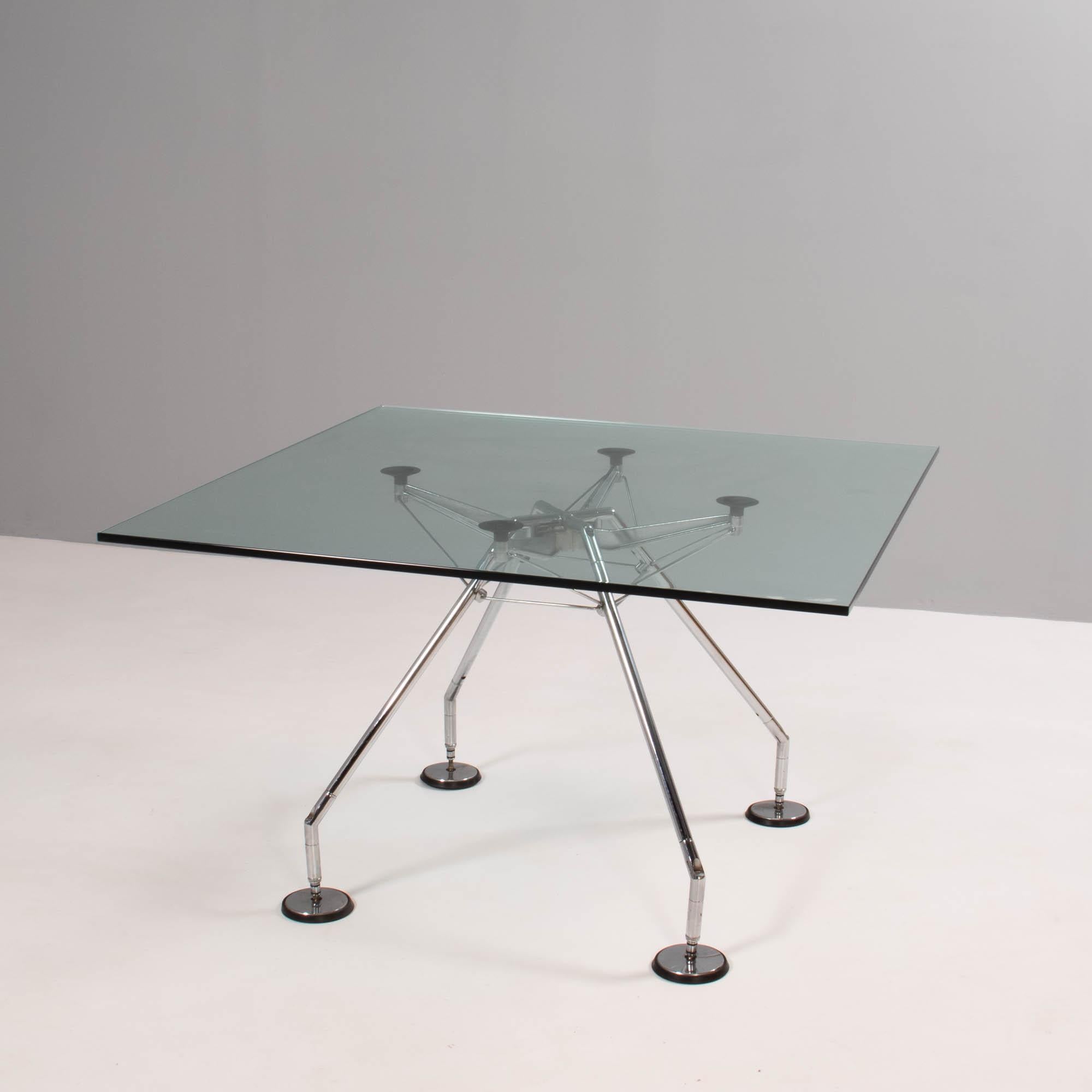 Originally designed by Sir Norman Foster in 1986, the Nomos table has an industrial post-modernist aesthetic.

Conceived as a zoomorphic skeleton, the base is the real focal point of the design, and the clear glass tabletop allows for an