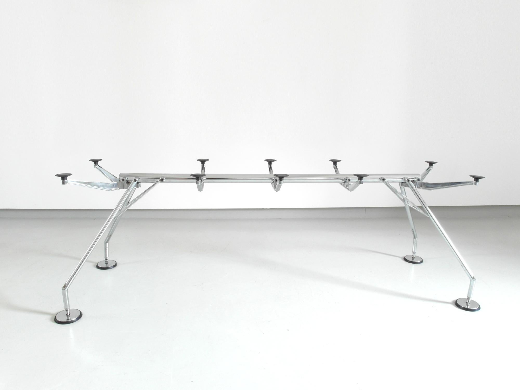 A large Nomos dining table, conference table or desk, designed in 1986 by Sir Norman Foster and manufactured by Tecno, Mariano Comense, Italy, 1986.
The frame of the Nomos table is conceived as a rigid, zoomorphic skeleton. The table’s striking