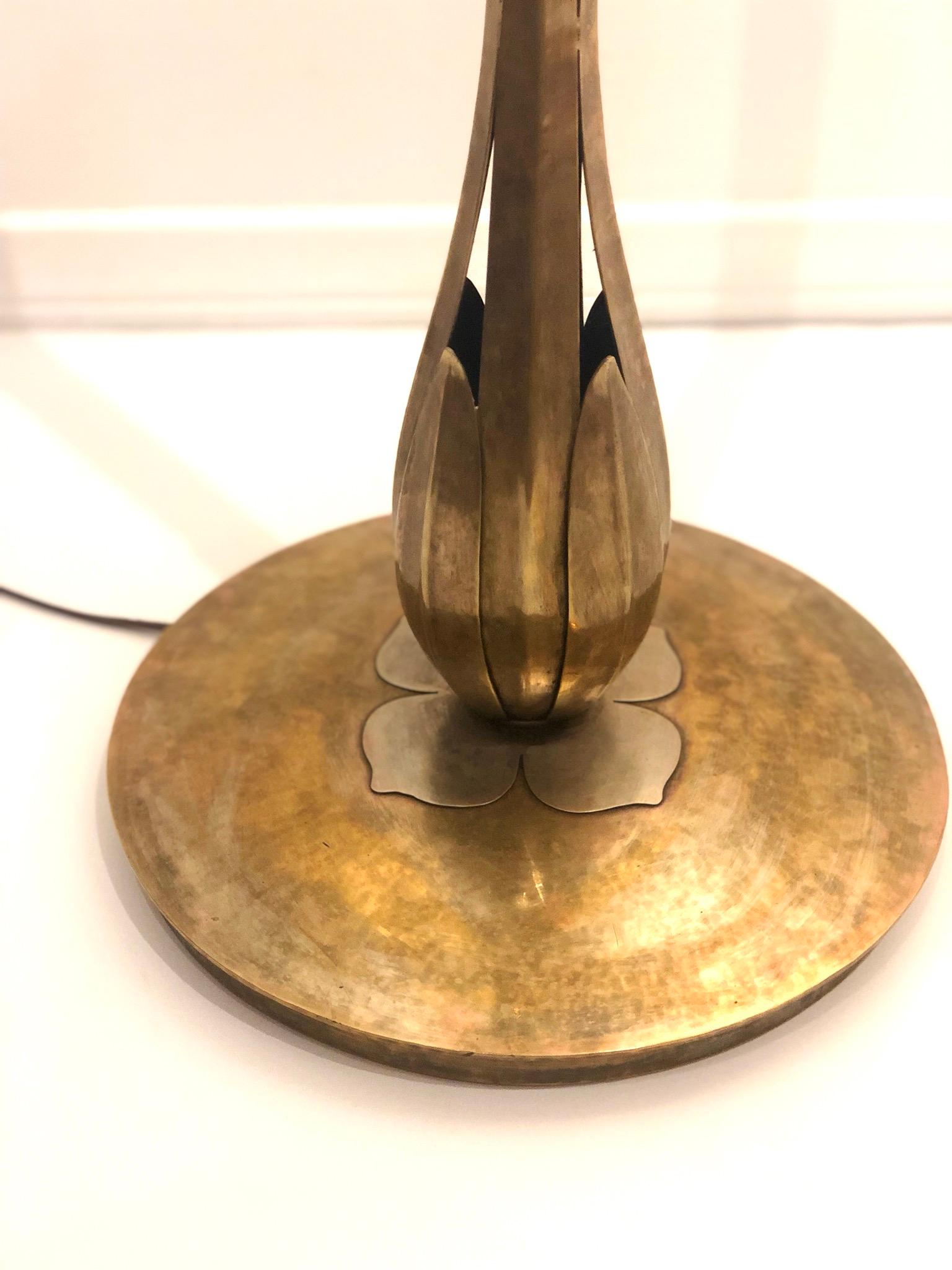 Handmade torchiere by Norman Grag of Grag Studios designed especially for Gumps in San Francisco. Brass patina finish with mixed metal accents. The lamp has been rewired and comes with a push off / on switch lightly polished and cleaned stamped at