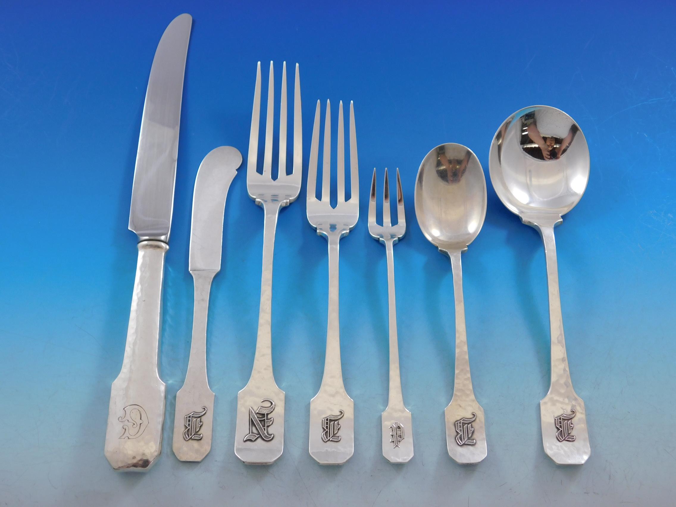 Dinner size Norman hammered by Shreve sterling silver flatware set - 87 pieces. This Arts & Crafts pattern was introduced in the year 1909. This set includes:

8 dinner knives, 9 3/4