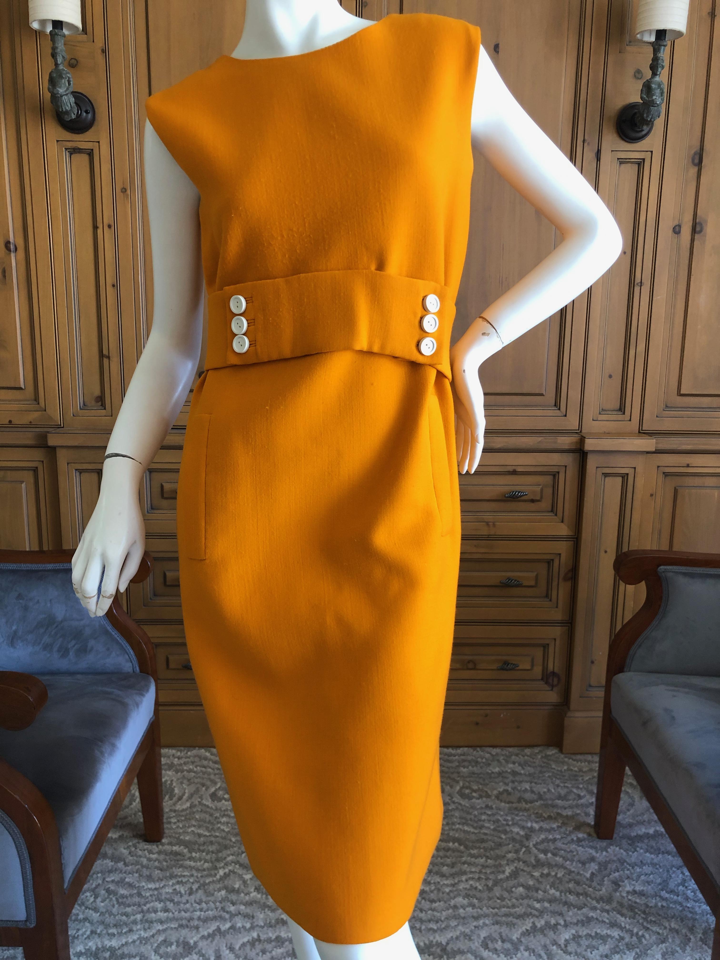 Norman Norell 1960's Sleeveless Orange Shift Dress with Attached Belt.
Lined in silk .
In excellent condition.
Bust 38
