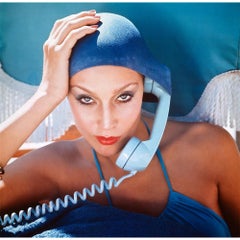 Vintage Jerry Hall takes a call in the pool