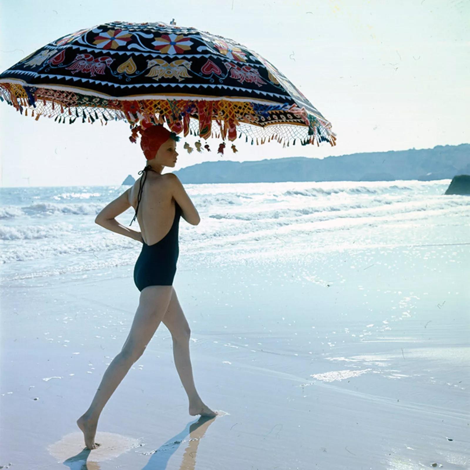 Mouche at Praia do Vau, Portugal wearing a Nina Ricci swimsuit. British Vogue magazine, January 1973.

Mouche at Praia do Vau, Portugal for Vogue, January 1973
Printed later
C print
Estate stamped and numbered edition of 21 on verso
with certificate