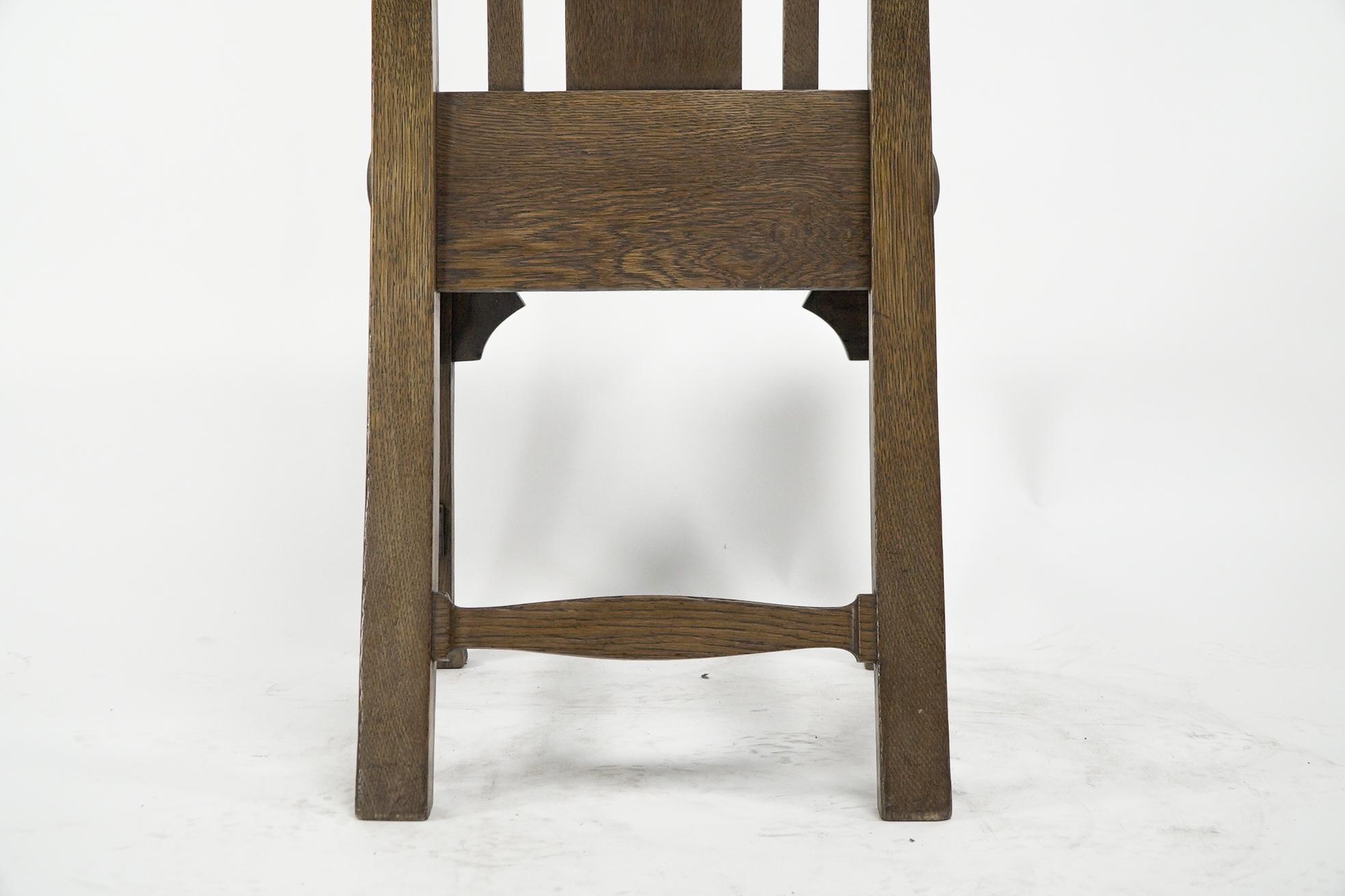 Norman & Stacey attributed. An Arts and Crafts high with shaped back oak chair For Sale 6