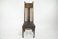 Norman & Stacey attributed. An Arts and Crafts high with shaped back oak chair