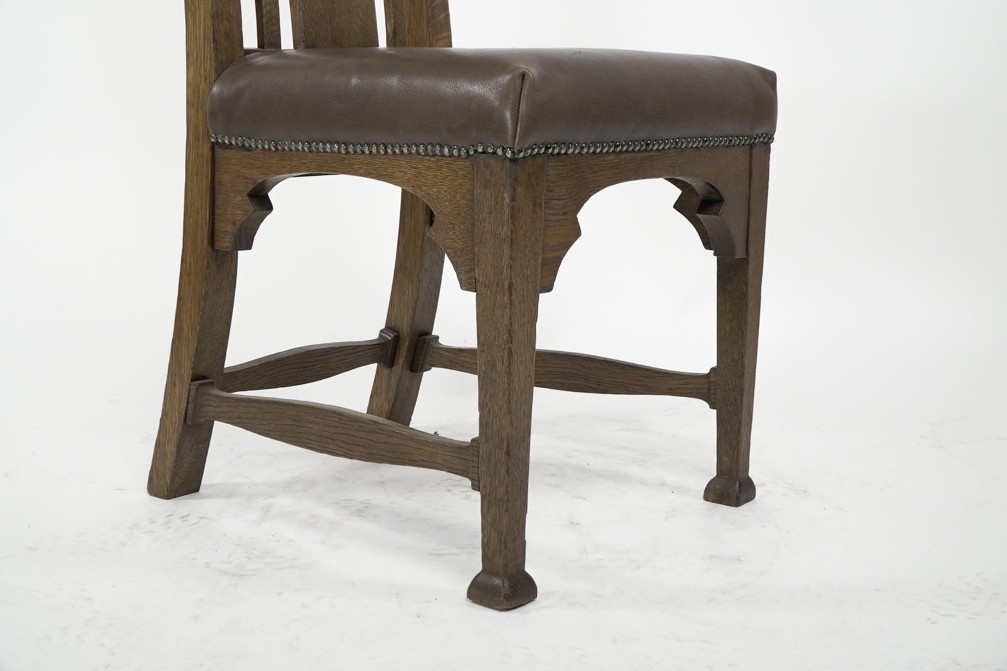 Norman & Stacey attributed. An Arts and Crafts high with shaped back oak chair For Sale 2