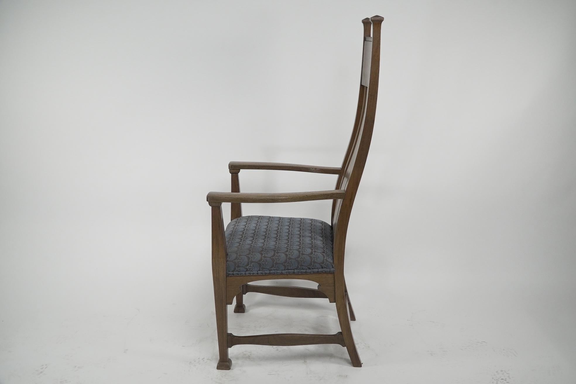 English Norman & Stacey (attributed). An Arts and Crafts walnut high back armchair For Sale