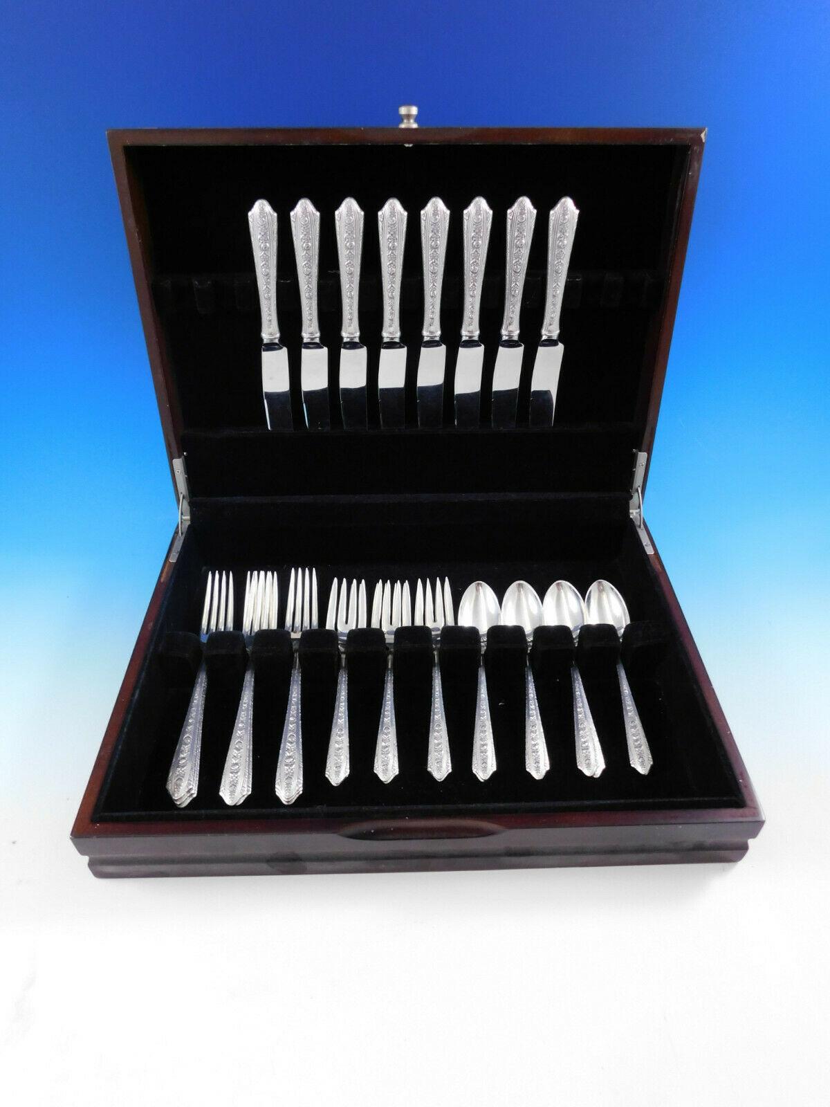 Normandie by Wallace silver flatware set with rose and daisy design, 32 pieces. This set includes:

8 knives, 8 3/4