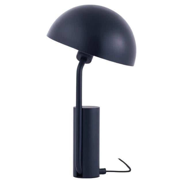 The lampshade can be moved around, letting you direct the light. Delivered with 2 m textile cord with switch.
Cap Table Lamp
Cap is a functional table lamp with an adjustable shade. The design is playful with lots of personality. Cap consists of a