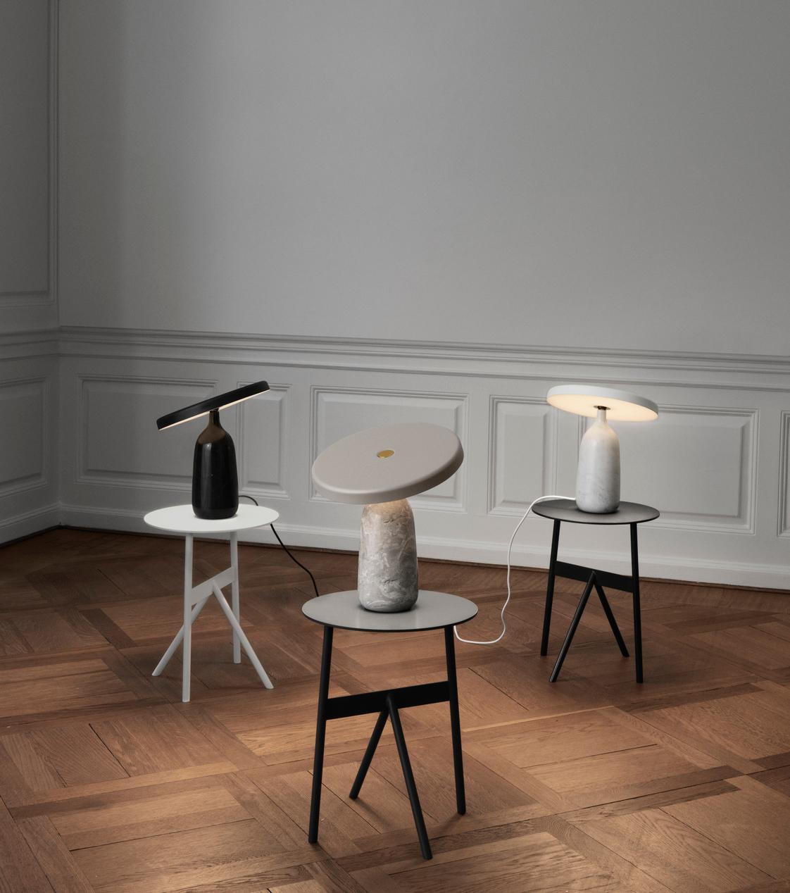 The table lamp consists of a steel screen with integrated LED light source and a lamp base made of hand turned Italian marble. Lampshade and base meet in a rotation point: a brass ball, which the shade can be tipped around to control the direction
