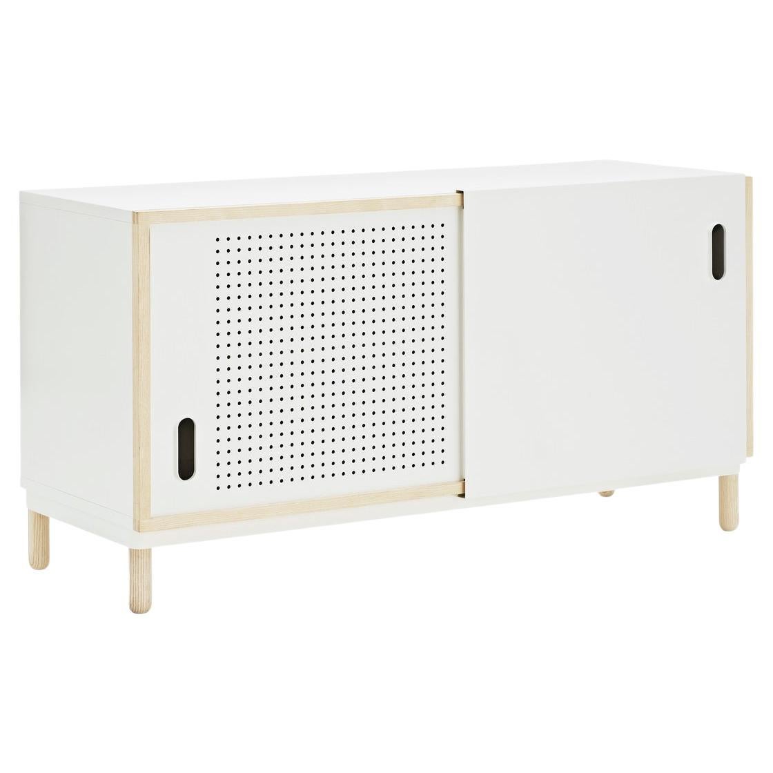 Kabino comes flat packed and is assembled using the included manual and tools. Kabino is made of painted MDF with an ash frame mounted to its front. Fronts are made of matt lacquered aluminum. 2 Kabinos can be stacked on top of each other if the