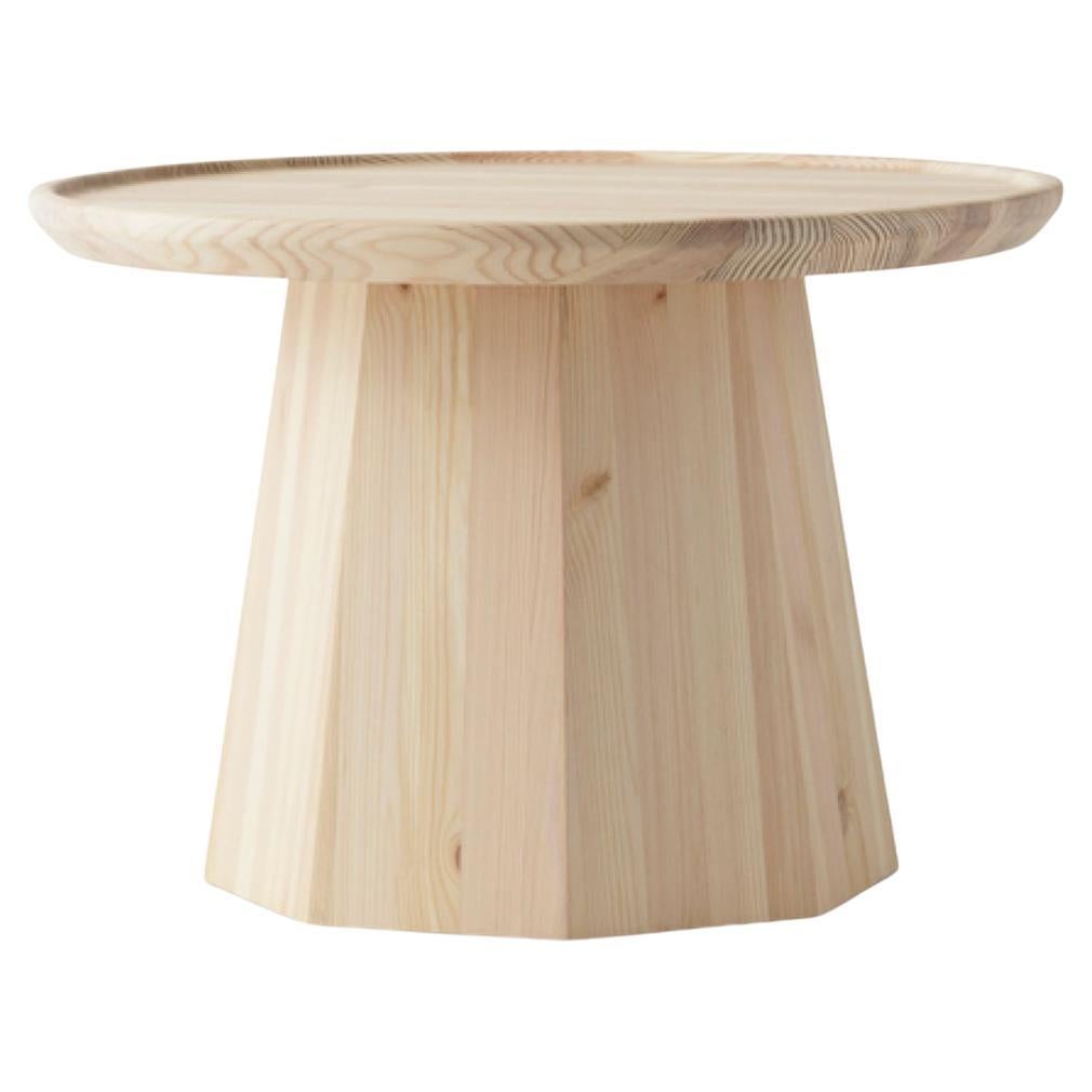 Pine is a collection of two small tables in pinewood. The combination of the sculptural octagonal foot and the light tabletop makes a characteristic design. Use the larger version as a coffee table or combine it with the smaller table that is