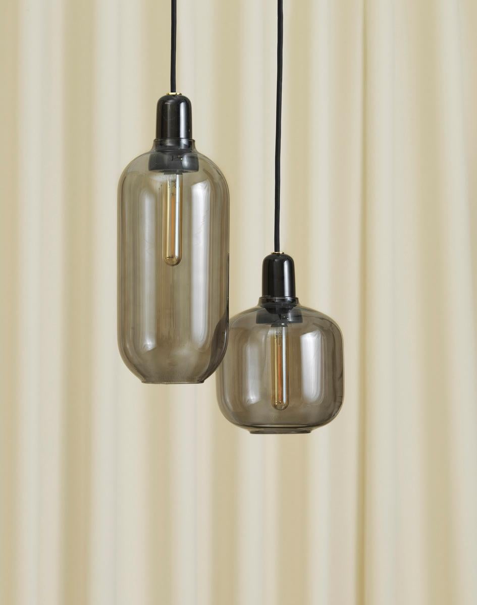 Price listed for 3 lamps. 

Amp is a range of small lamps inspired by old tube amplifiers from the 1960s. The unique shapes and classic materials of marble and glass add a nostalgic and at the same time, contemporary feel to Amp. 
The decorative
