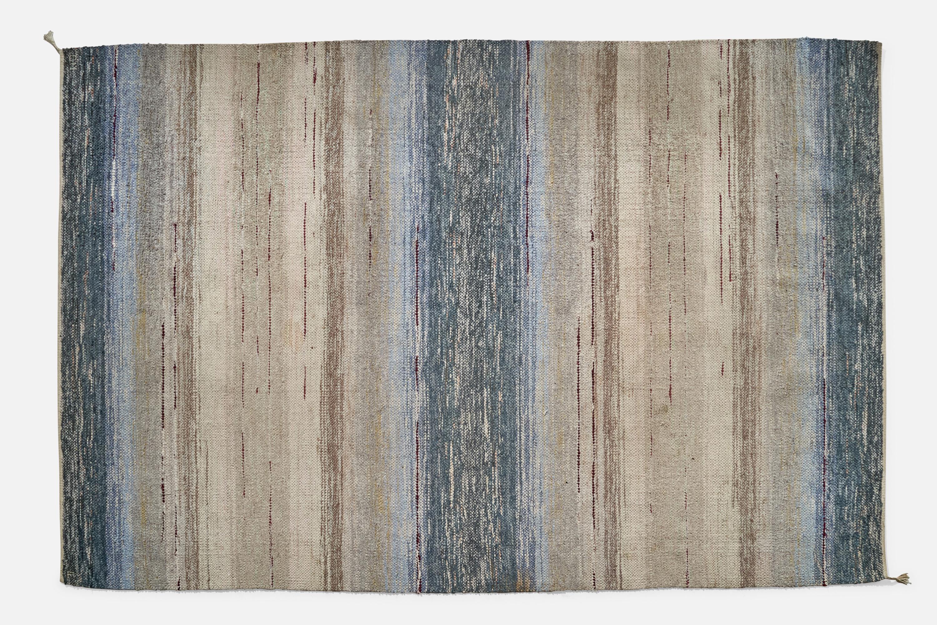 A blue grey carpet or rug rag produced by Norrbottens Hemslöjdsförening, Sweden, c. 1950s.
