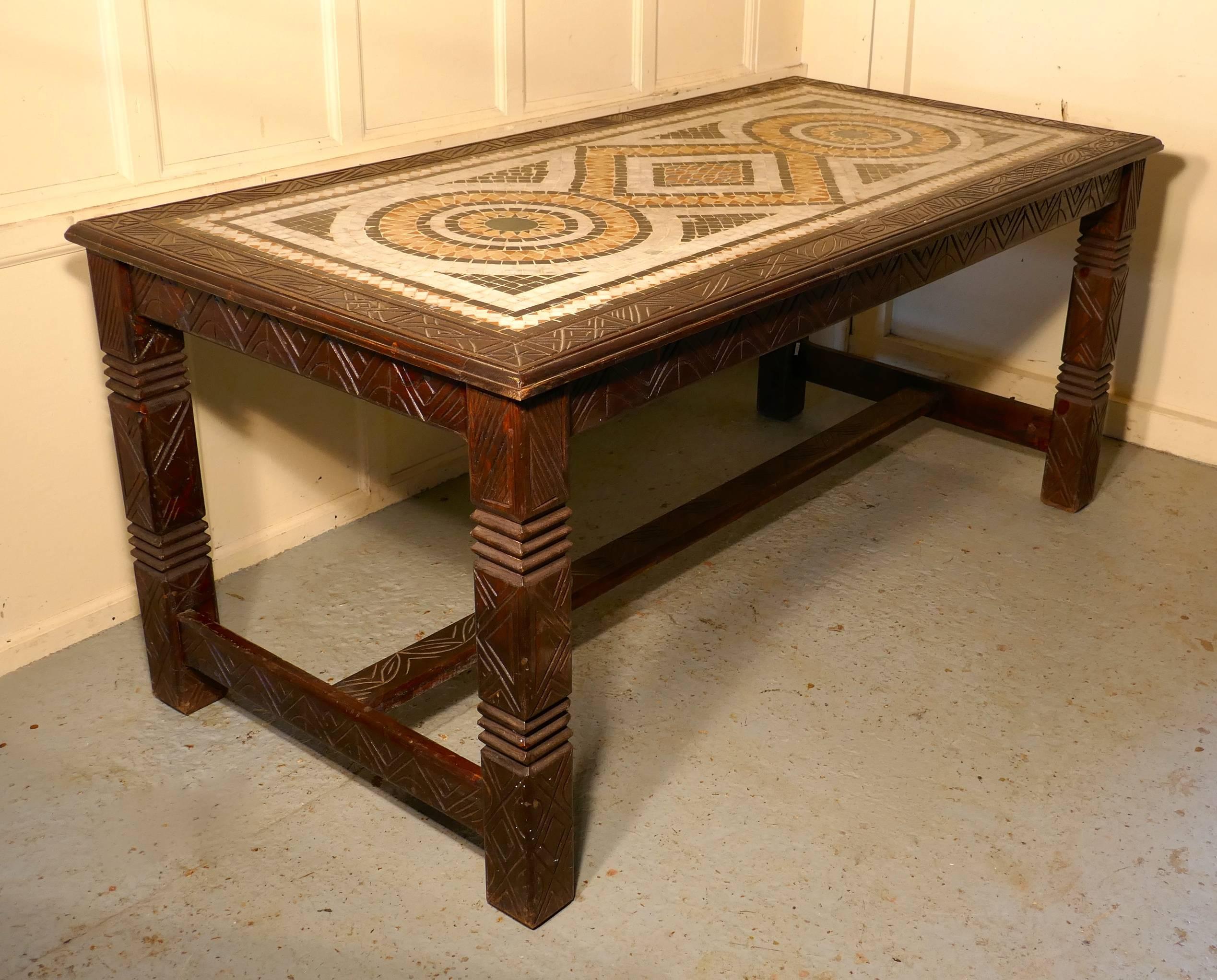 North African marble Mosaic table

A table with a difference, this table is made in solid wood with primitive carved decoration on the legs, stretcher and the border around the tabletop

The centre the 1.5” thick table top is lovely mosaic made