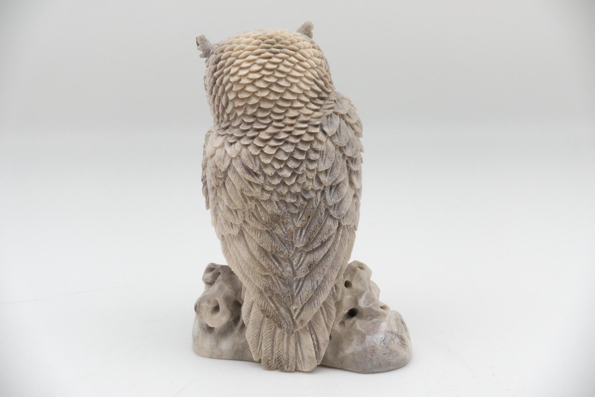 Moose antler carving of a horned owl. Antler was sourced in North America, then sent to Asia for carving. Quality of ivory, but with sustainability, as the moose naturally shed their antlers.