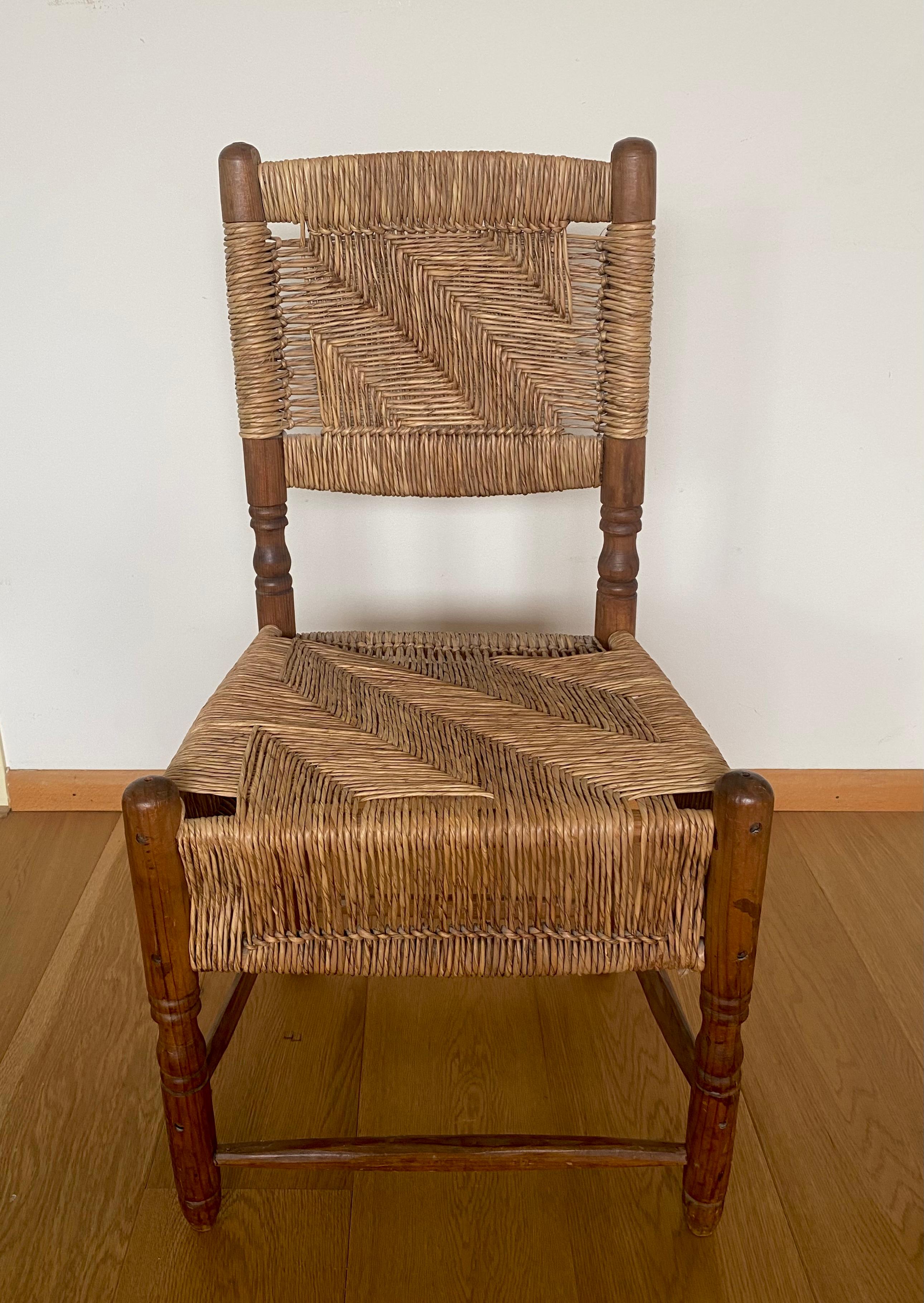 Beautiful Woven Vintage Chair, with robust wooden Base and woven seats. Most likely the chair was manufactured in America, however looking Spanish. Except for the patina, the chair remains in good condition with normal signs of age and use.