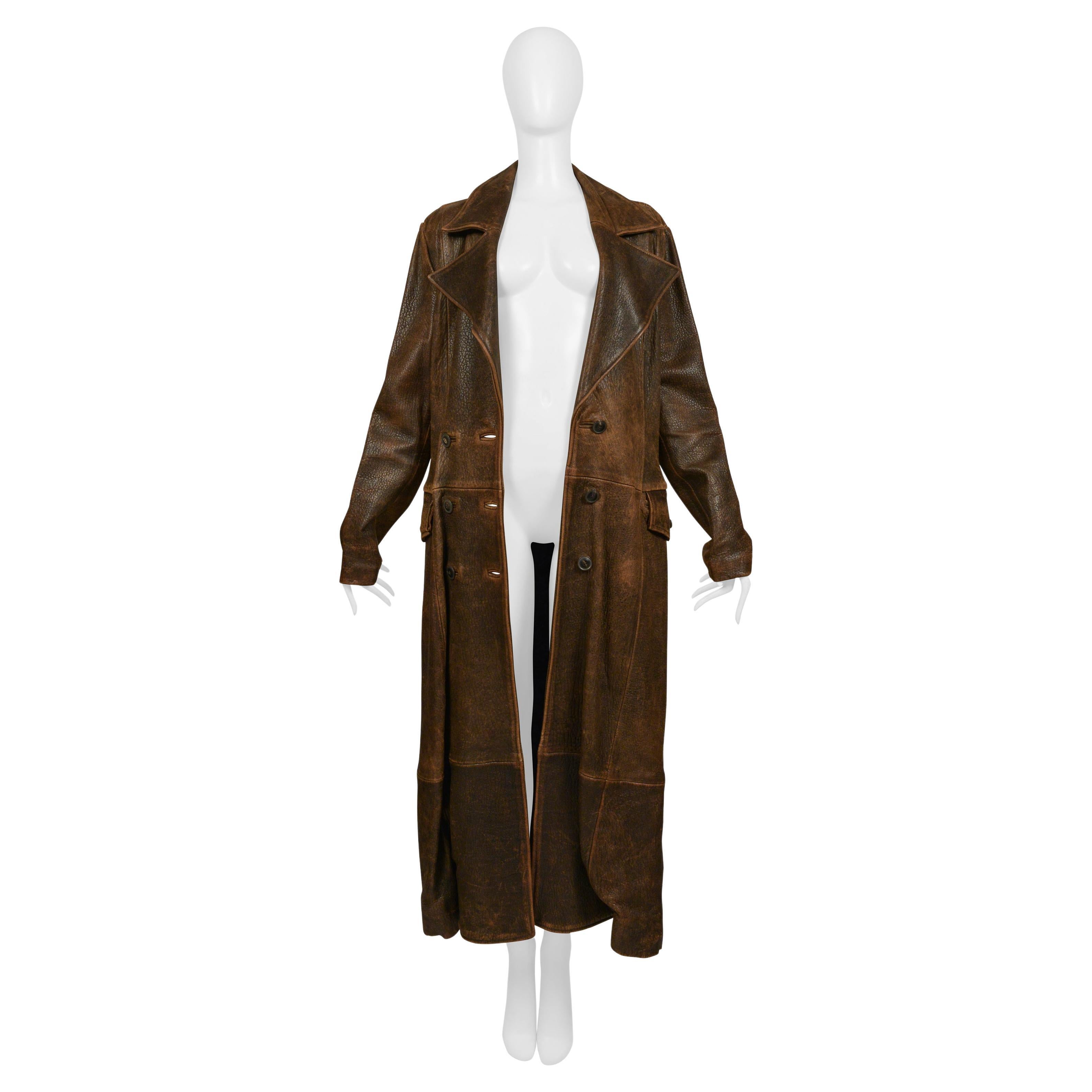 Resurrection is offering a vintage brown North Beach Leather aviator-style coat. The coat features a double-breasted front, an oversized collar, side flap pockets, a flattering low hip drop seam, full lining, and a floor-length design.
* North Beach