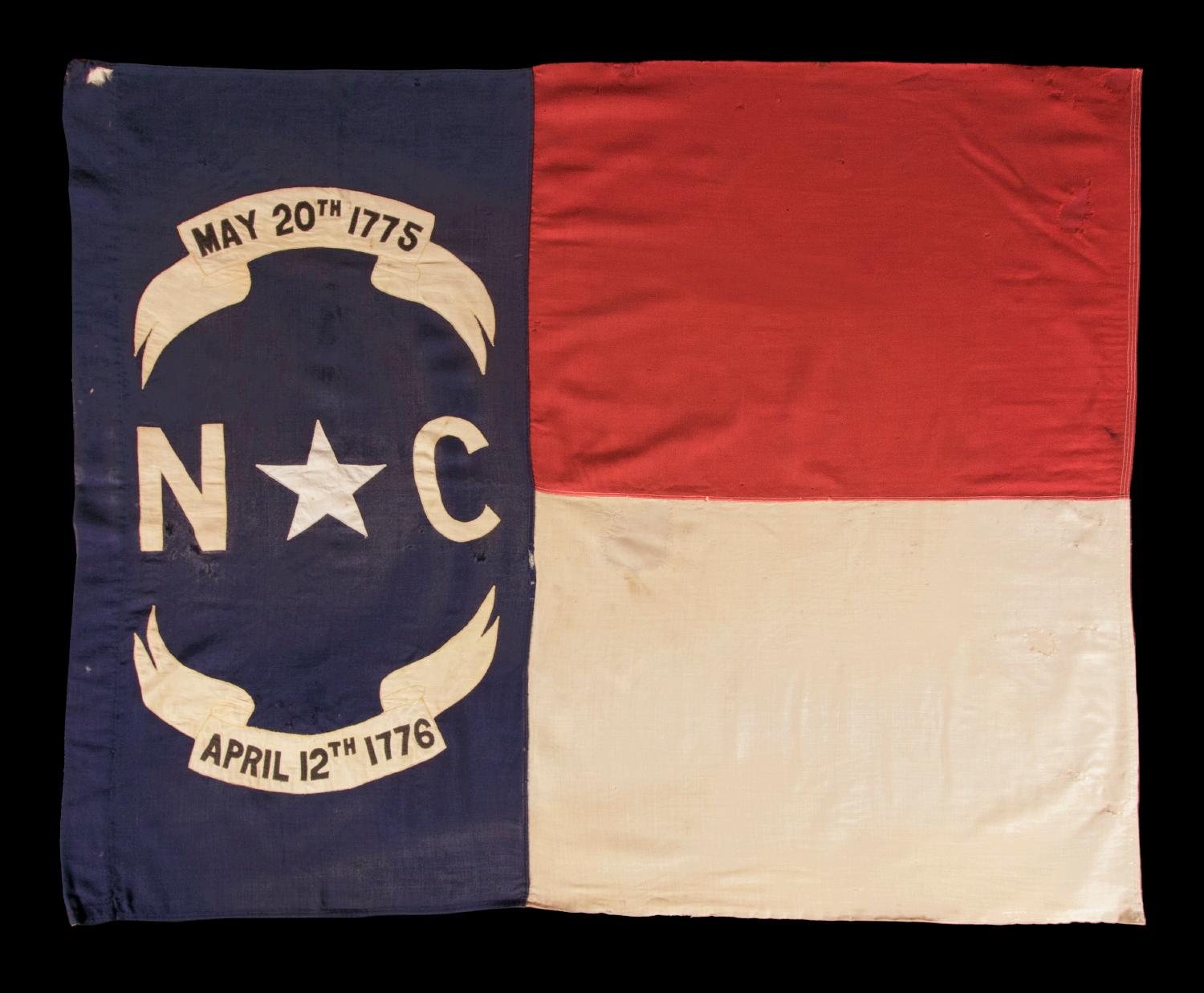 STATE FLAG OF NORTH CAROLINA, CA 1900-WWI ERA (U.S. INVOLVEMENT 1917-18), A RARE EXAMPLE, WITH BATTLE-FLAG-LIKE PROPORTIONS, MADE TO BE HAND-CARRIED ON A STAFF:

Many people are unaware that individual states generally didn't adopt flags until the