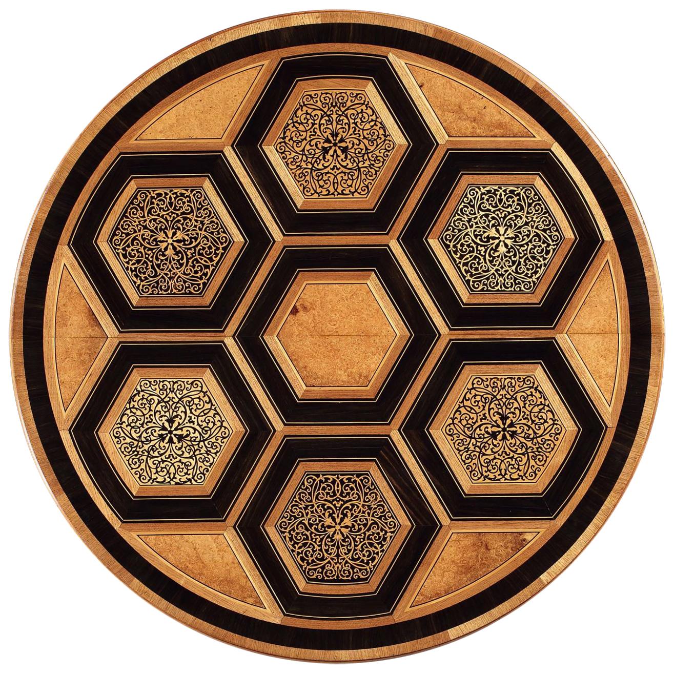 Thank you for your interest in this beautiful center table. Please do enquire for a competitive shipping quote. 

Nicholas Wells antiques are pleased to offer this fine and unusual marquetry centre table, the top inlaid with a geometric